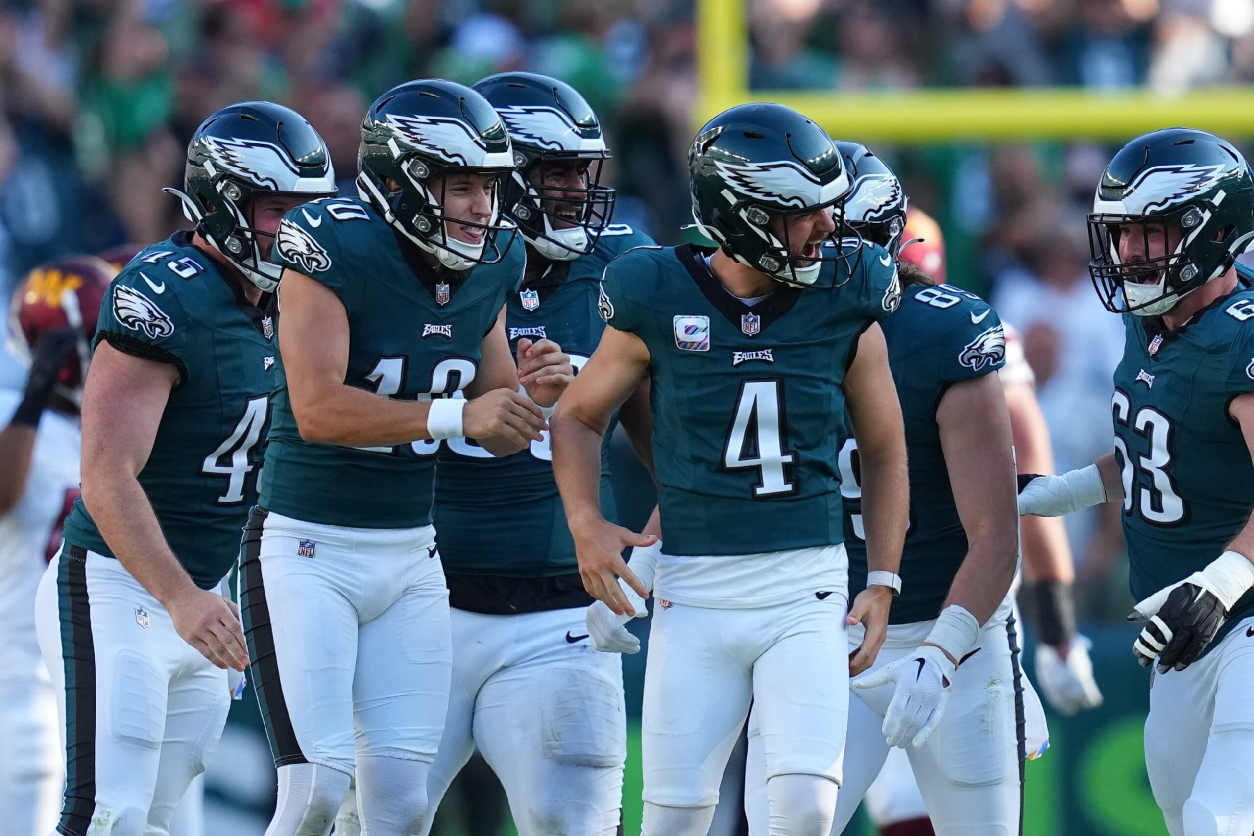 PHILADELPHIA, PENNSYLVANIA - OCTOBER 1: Jake Elliott #4 of the Philadelphia Eagles celebrates with teammates after kicking the game winning field goal in overtime against the Washington Commanders at Lincoln Financial Field on October 1, 2023 in Philadelphia, Pennsylvania. (Photo by Mitchell Leff/Getty Images)