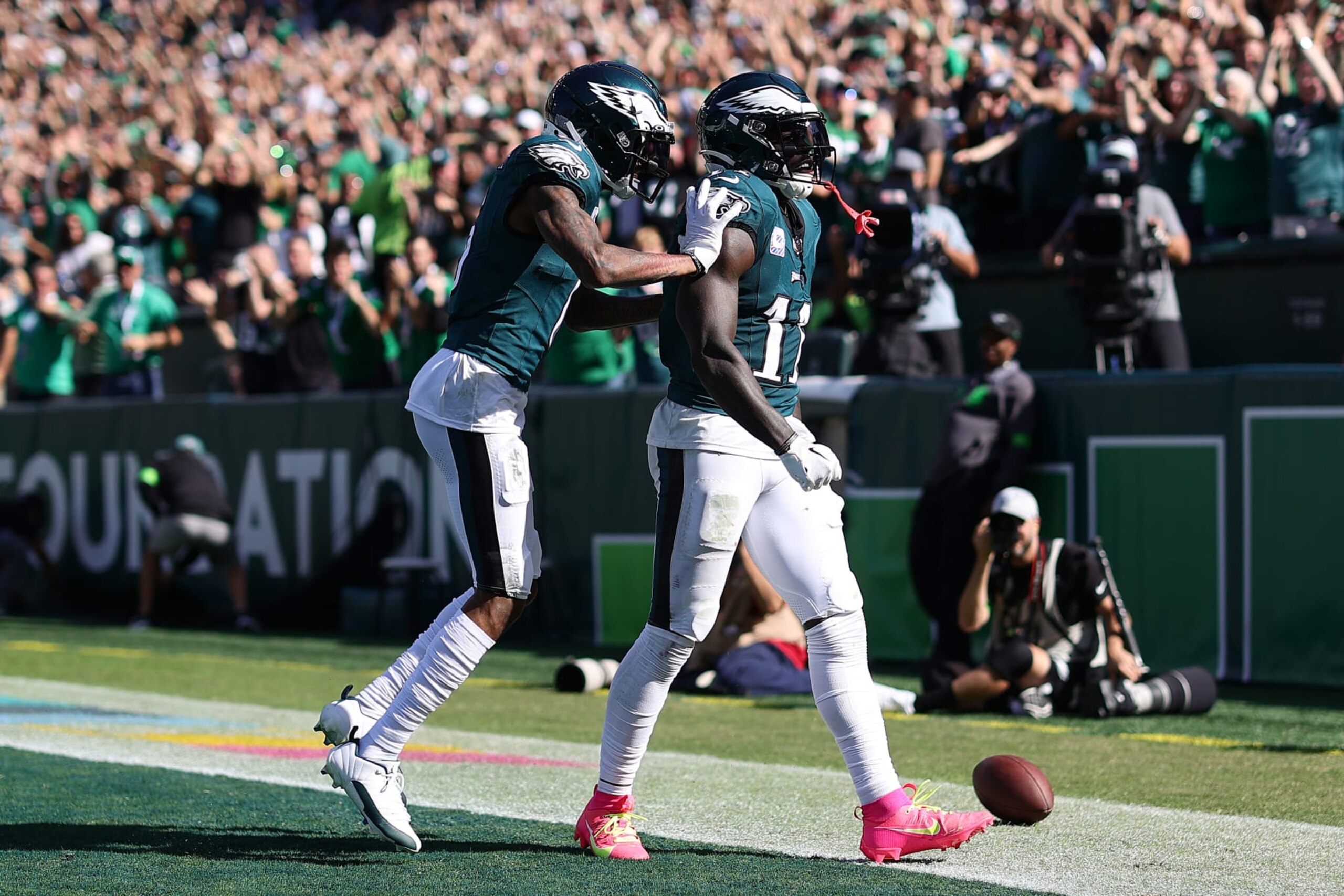 PHILADELPHIA, PENNSYLVANIA - OCTOBER 01: DeVonta Smith #6 and A.J. Brown #11 of the Philadelphia Eagles celebrate Brown's touchdown against the Washington Commanders during the third quarter at Lincoln Financial Field on October 01, 2023 in Philadelphia, Pennsylvania. (Photo by Tim Nwachukwu/Getty Images)