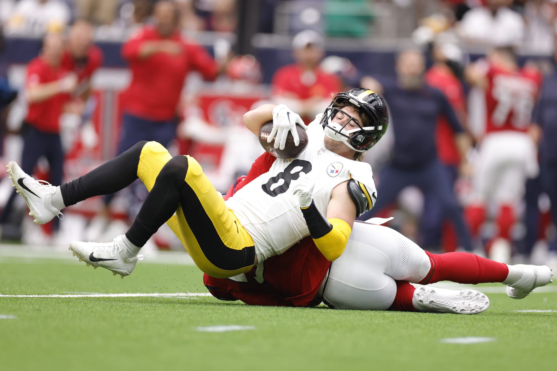 HOUSTON, TEXAS - OCTOBER 01: Jerry Hughes #55 of the Houston Texans sacks Kenny Pickett #8 of the Pittsburgh Steelers during the first quarter at NRG Stadium on October 01, 2023 in Houston, Texas. (Photo by Carmen Mandato/Getty Images)