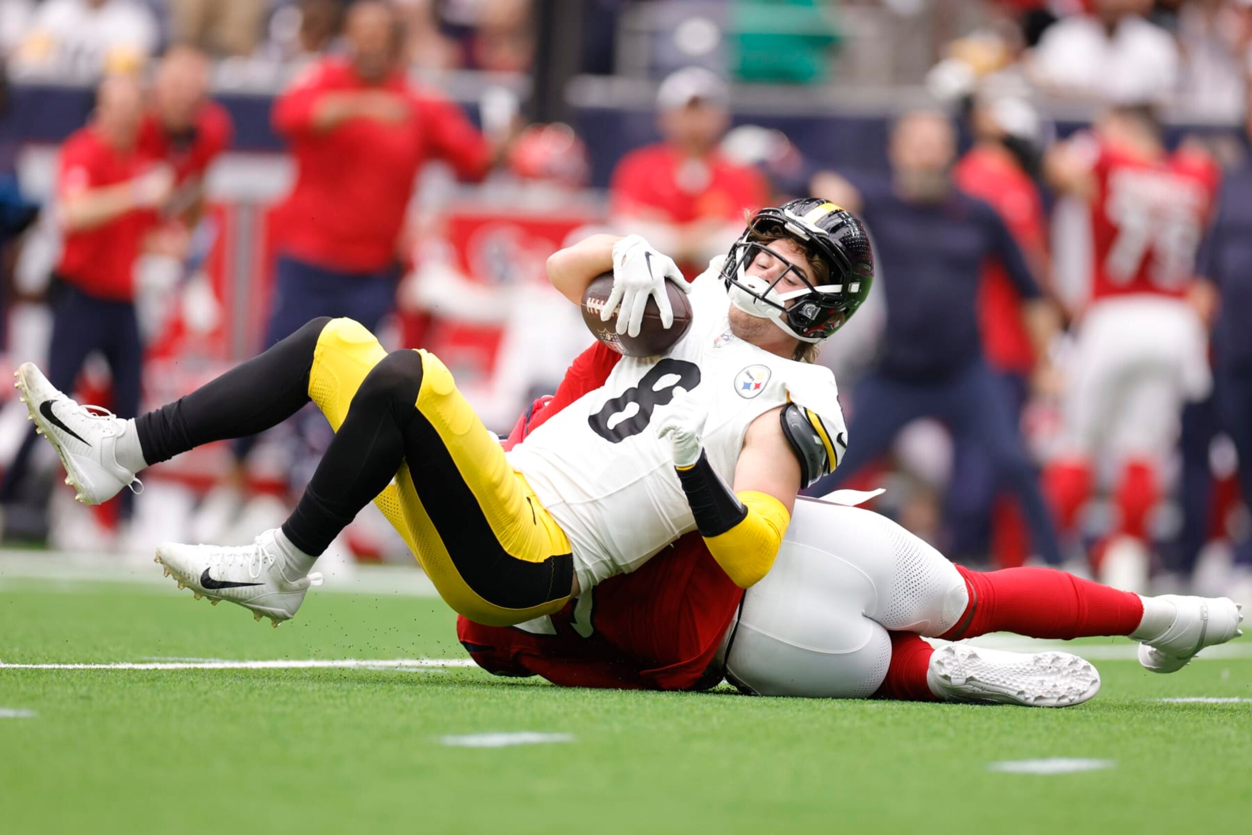 HOUSTON, TEXAS - OCTOBER 01: Jerry Hughes #55 of the Houston Texans sacks Kenny Pickett #8 of the Pittsburgh Steelers during the first quarter at NRG Stadium on October 01, 2023 in Houston, Texas. (Photo by Carmen Mandato/Getty Images)