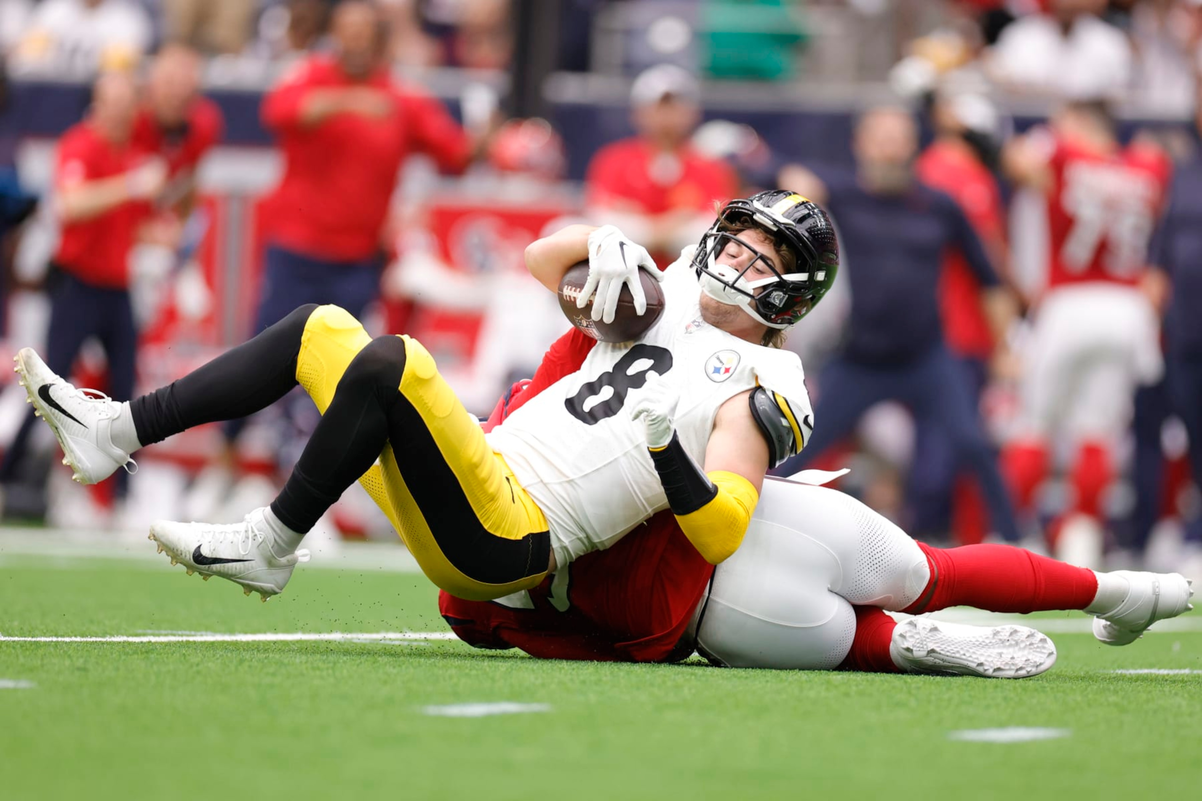 HOUSTON, TEXAS - OCTOBER 01: Jerry Hughes #55 of the Houston Texans sacks Kenny Pickett #8 of the Pittsburgh Steelers during the first quarter at NRG Stadium on October 01, 2023 in Houston, Texas. (Photo by Carmen Mandato/Getty Images)