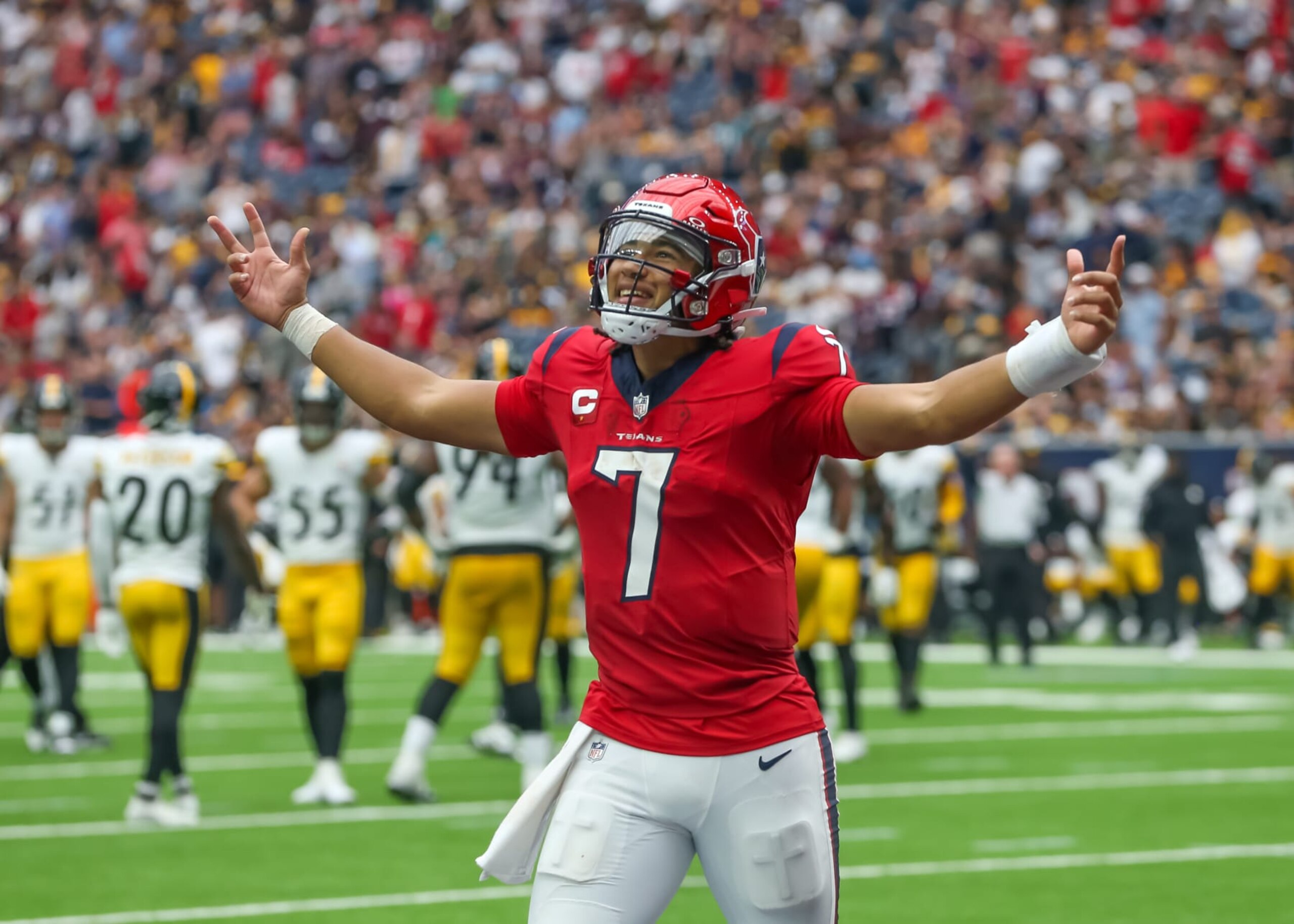 HOUSTON, TX - OCTOBER 01:  Houston Texans quarterback C.J. Stroud (7) signals in victory to fans following the Houston Texans wide receiver Nico Collins (12) touchdown in the fourth quarter during the NFL game between the Pittsburgh Steelers and Houston Texans on October 1, 2023 at NRG Stadium in Houston, Texas.  (Photo by Leslie Plaza Johnson/Icon Sportswire via Getty Images)