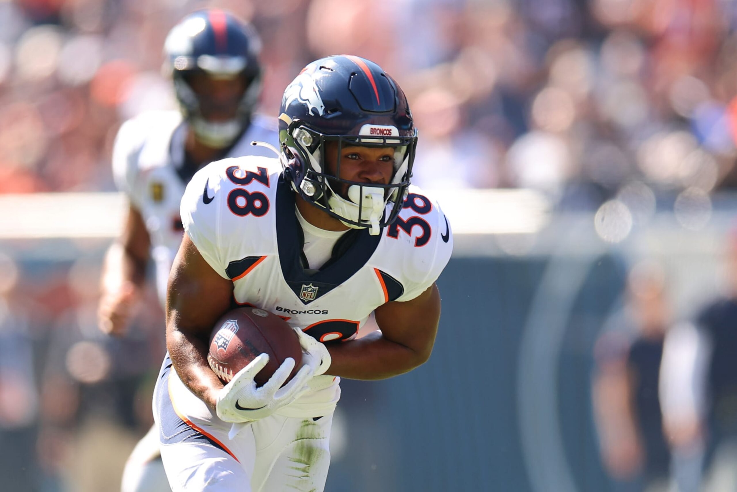 CHICAGO, ILLINOIS - OCTOBER 01: Jaleel McLaughlin #38 of the Denver Broncos scores a touchdown against the Chicago Bears during the first quarter at Soldier Field on October 01, 2023 in Chicago, Illinois. (Photo by Michael Reaves/Getty Images) CHICAGO, ILLINOIS - OCTOBER 01: Jaleel McLaughlin #38 of the Denver Broncos scores a touchdown against the Chicago Bears during the first quarter at Soldier Field on October 01, 2023 in Chicago, Illinois. (Photo by Michael Reaves/Getty Images)