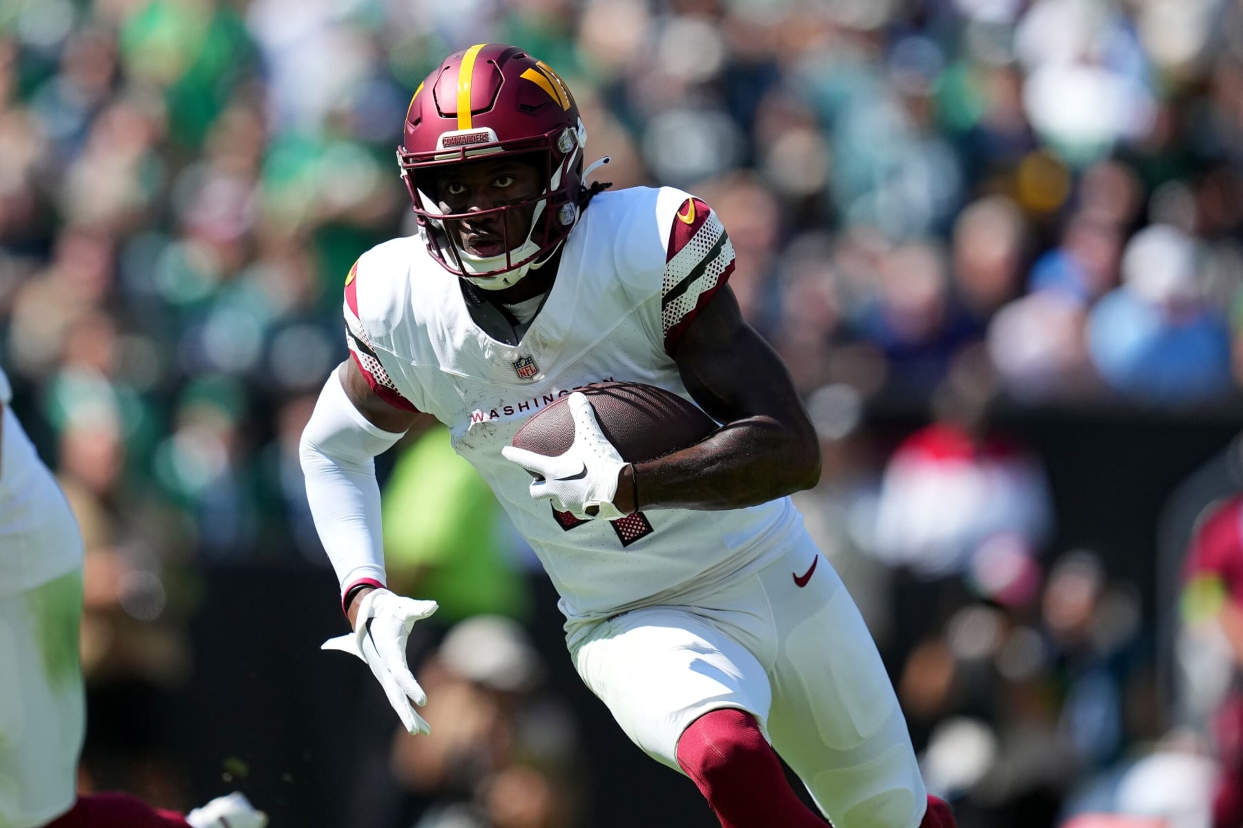PHILADELPHIA, PENNSYLVANIA - OCTOBER 01: Curtis Samuel #4 of the Washington Commanders runs with the ball for a touchdown during the first quarter against the Philadelphia Eagles at Lincoln Financial Field on October 01, 2023 in Philadelphia, Pennsylvania. (Photo by Mitchell Leff/Getty Images) PHILADELPHIA, PENNSYLVANIA - OCTOBER 01: Curtis Samuel #4 of the Washington Commanders runs with the ball for a touchdown during the first quarter against the Philadelphia Eagles at Lincoln Financial Field on October 01, 2023 in Philadelphia, Pennsylvania. (Photo by Mitchell Leff/Getty Images)