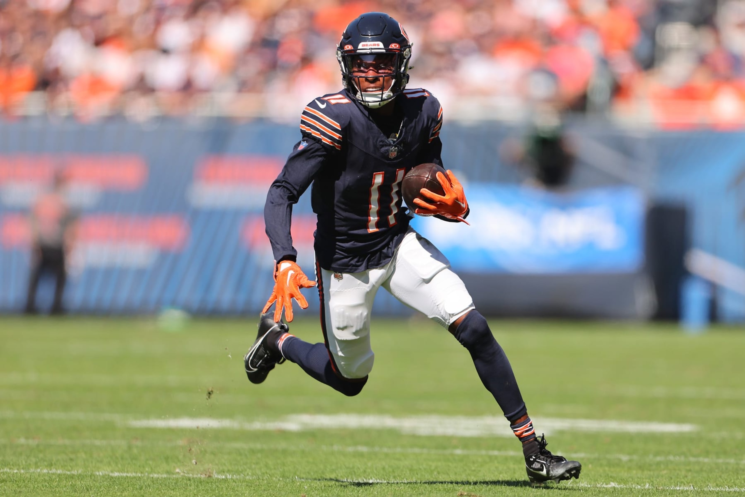 CHICAGO, ILLINOIS - OCTOBER 01: Darnell Mooney #11 of the Chicago Bears runs with the ball against the Denver Broncos during the first quarter at Soldier Field on October 01, 2023 in Chicago, Illinois. (Photo by Michael Reaves/Getty Images)