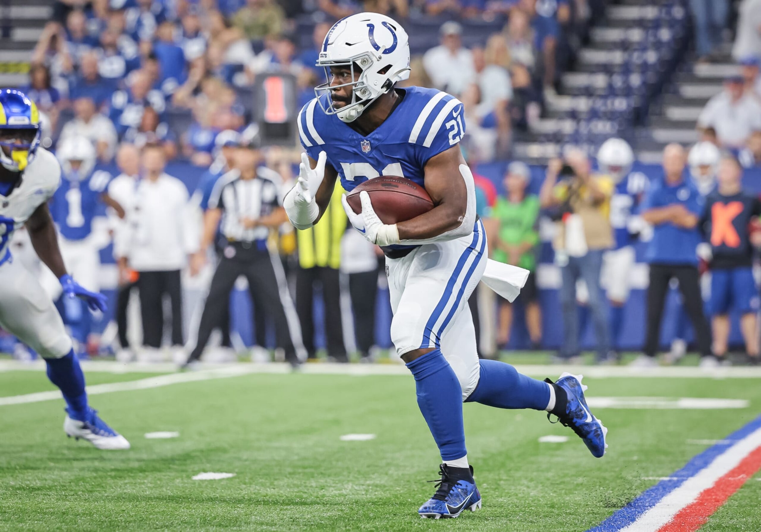 INDIANAPOLIS, INDIANA - OCTOBER 1: Zack Moss #21 of the Indianapolis Colts runs the ball against the Los Angeles Rams at Lucas Oil Stadium on October 1, 2023 in Indianapolis, Indiana. (Photo by Michael Hickey/Getty Images)