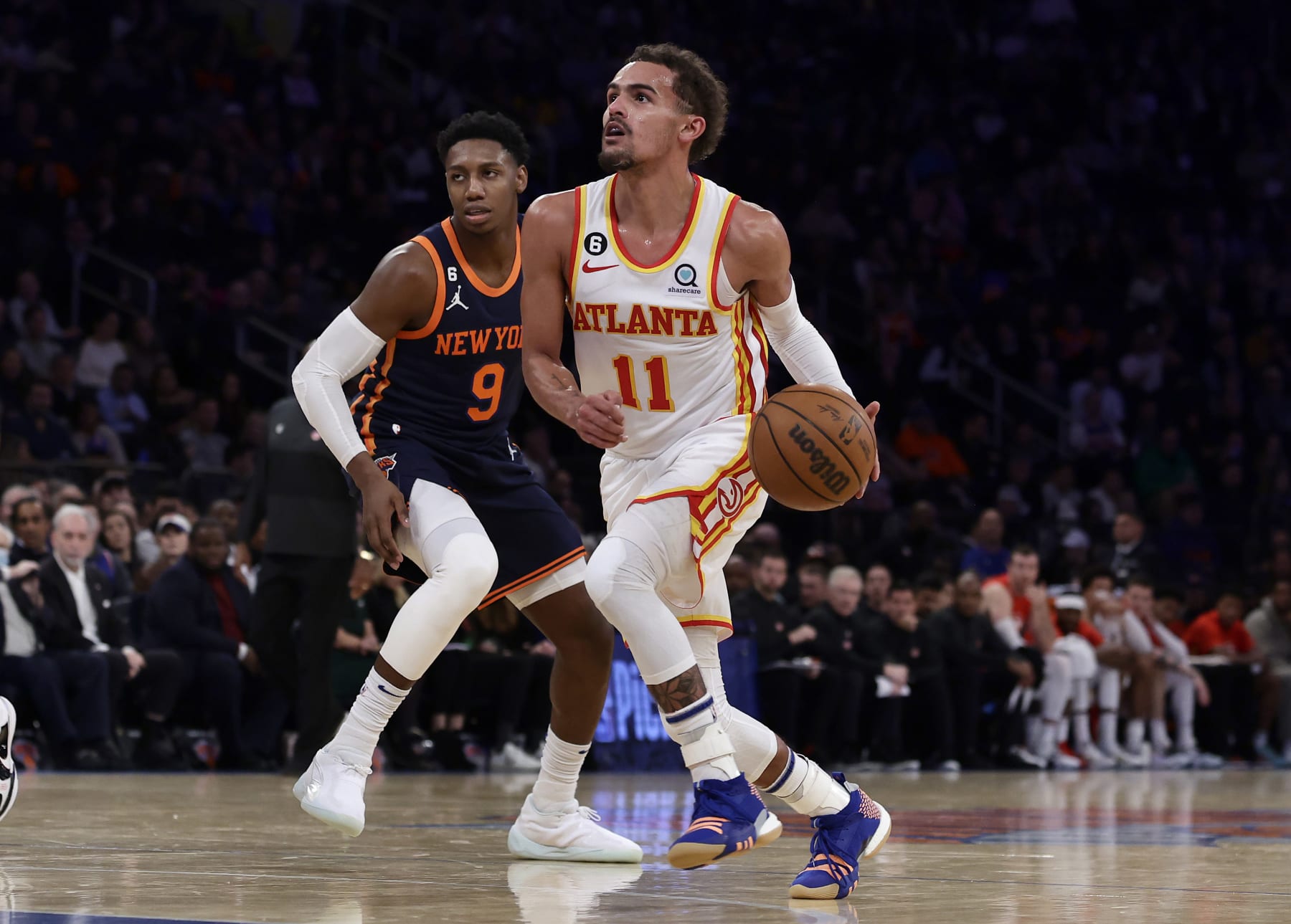 NEW YORK, NEW YORK - DECEMBER 07: (NEW YORK DAILIES OUT)  Trae Young #11 of the Atlanta Hawks in action against RJ Barrett #9 of the New York Knicks at Madison Square Garden on December 07, 2022 in New York City. The Knicks defeated the Hawks 113-89. NOTE TO USER: User expressly acknowledges and agrees that, by downloading and or using this photograph, User is consenting to the terms and conditions of the Getty Images License Agreement. (Photo by Jim McIsaac/Getty Images)