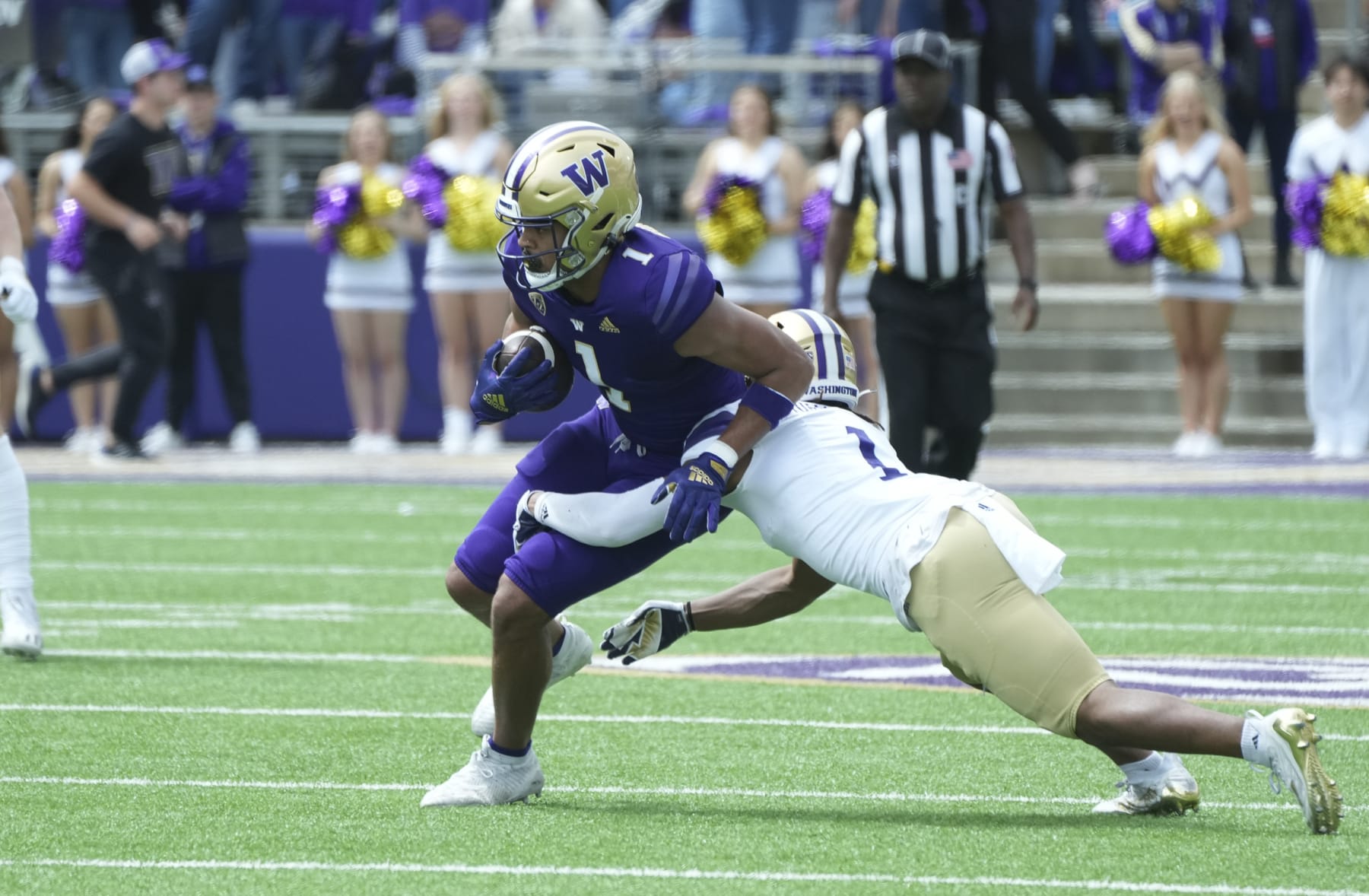 Seattle, WA - APRIL 22: Washington Husky receiver Rome Odunze (1) picks up yardage against Washington Husky cornerback Jabbar Muhammad (1) during the Washington Husky Spring game on April 22, 2023 at Husky Stadium in Seattle, WA. (Photo by Jeff Halstead/Icon Sportswire via Getty Images)