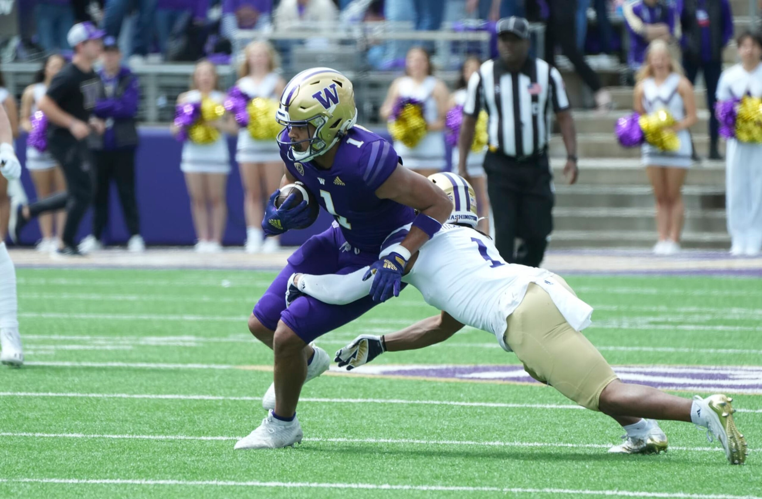Seattle, WA - APRIL 22: Washington Husky receiver Rome Odunze (1) picks up yardage against Washington Husky cornerback Jabbar Muhammad (1) during the Washington Husky Spring game on April 22, 2023 at Husky Stadium in Seattle, WA. (Photo by Jeff Halstead/Icon Sportswire via Getty Images)
