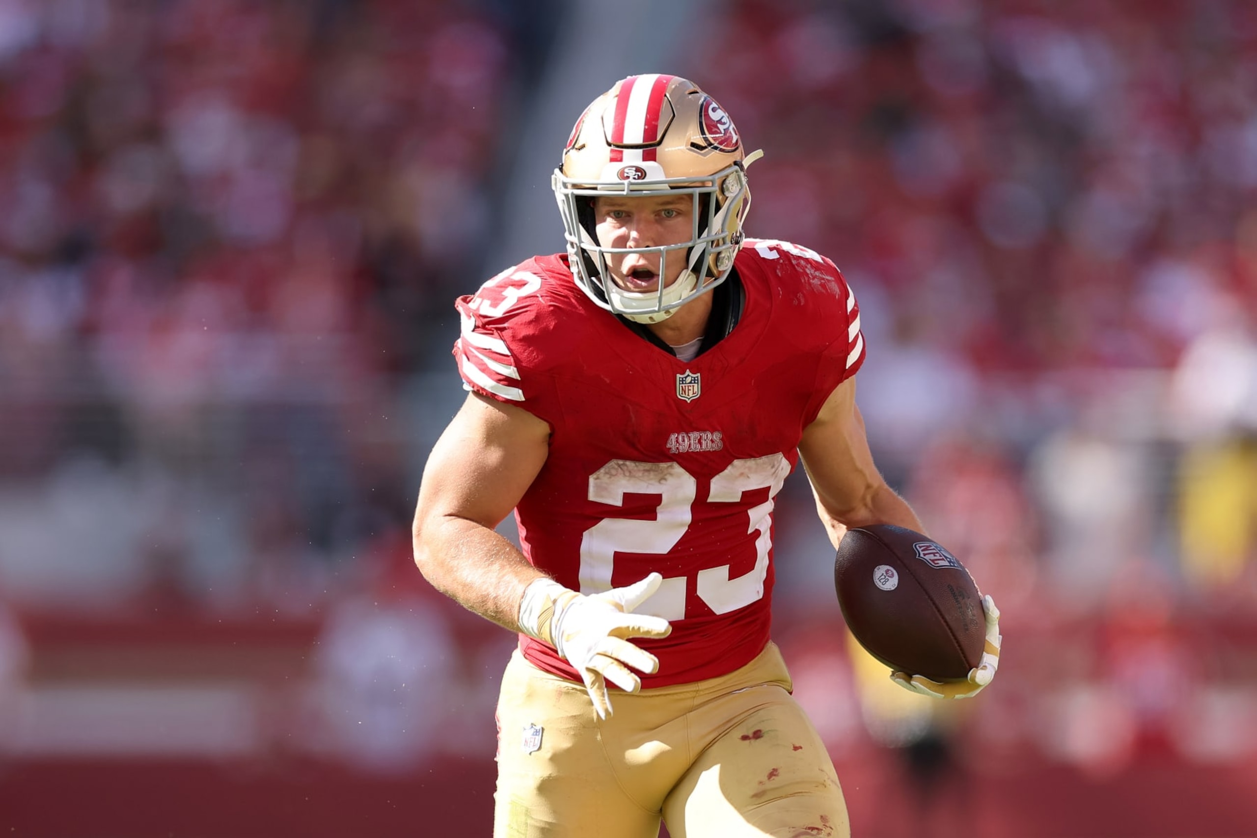SANTA CLARA, CALIFORNIA - OCTOBER 01: Christian McCaffrey #23 of the San Francisco 49ers runs with the ball against the Arizona Cardinals at Levi's Stadium on October 01, 2023 in Santa Clara, California. (Photo by Ezra Shaw/Getty Images) SANTA CLARA, CALIFORNIA - OCTOBER 01: Christian McCaffrey #23 of the San Francisco 49ers runs with the ball against the Arizona Cardinals at Levi's Stadium on October 01, 2023 in Santa Clara, California. (Photo by Ezra Shaw/Getty Images)