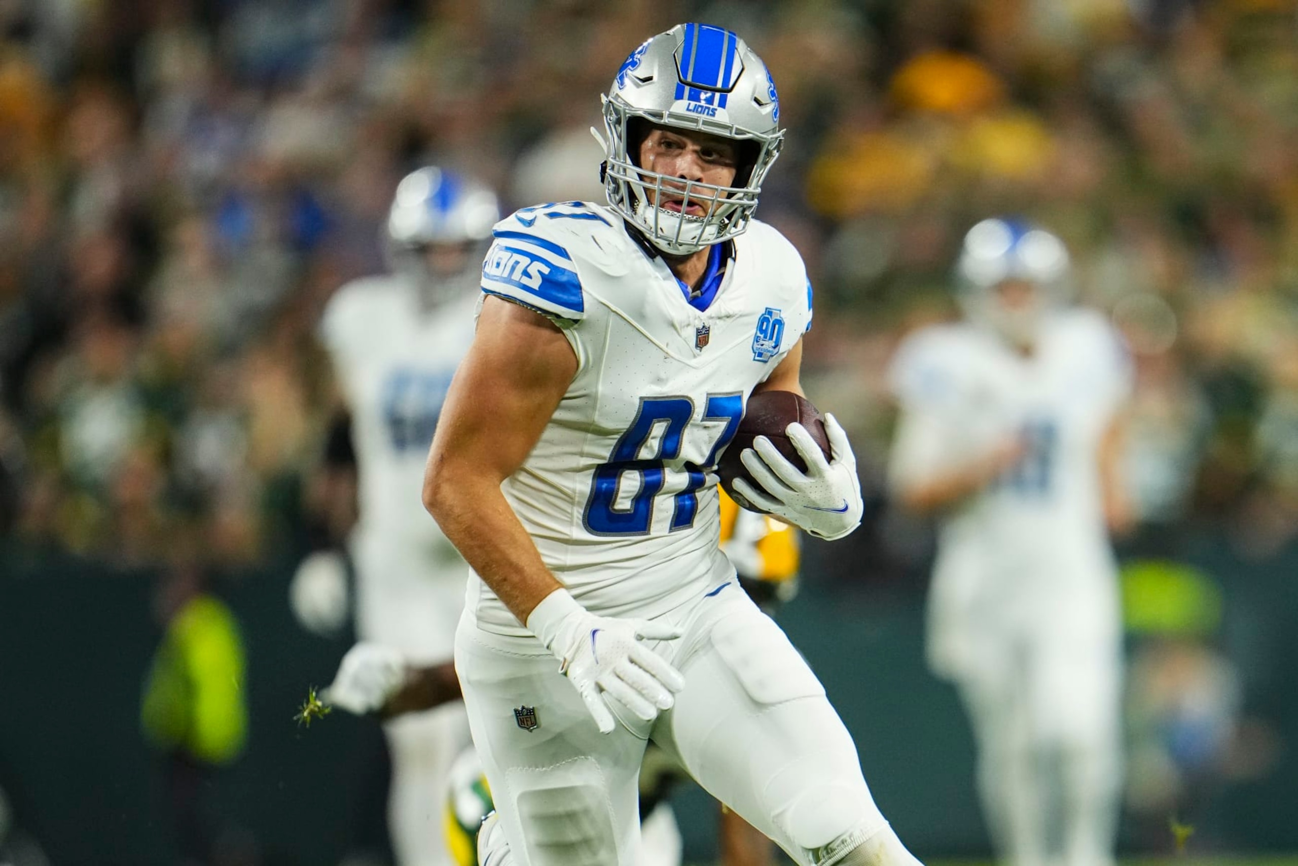 GREEN BAY, WI - SEPTEMBER 28: Sam LaPorta #87 of the Detroit Lions runs the ball during at Lambeau Field on September 28, 2023 in Green Bay, Wisconsin. (Photo by Cooper Neill/Getty Images) GREEN BAY, WI - SEPTEMBER 28: Sam LaPorta #87 of the Detroit Lions runs the ball during at Lambeau Field on September 28, 2023 in Green Bay, Wisconsin. (Photo by Cooper Neill/Getty Images)