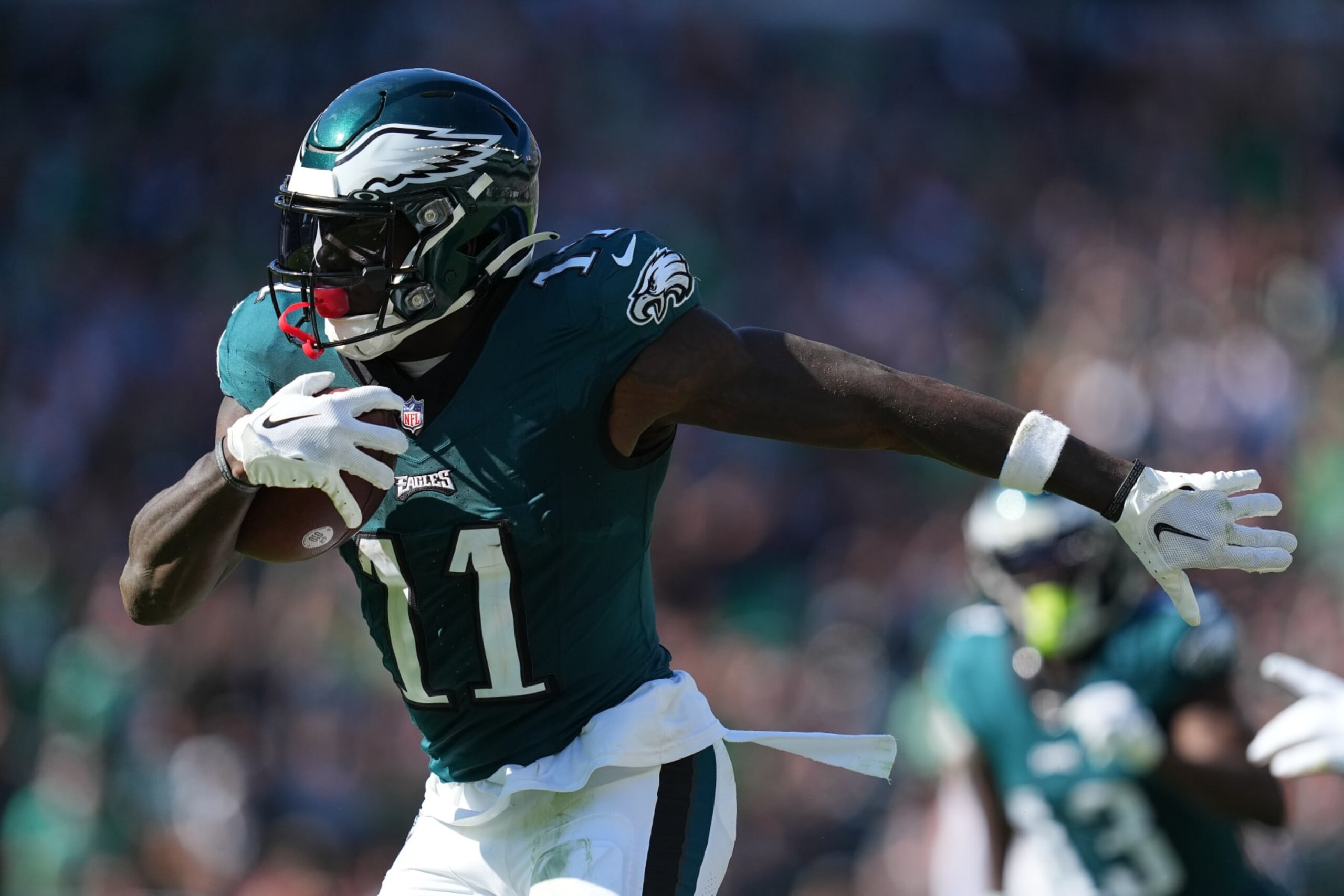 PHILADELPHIA, PENNSYLVANIA - OCTOBER 1: A.J. Brown #11 of the Philadelphia Eagles runs with the ball against the Washington Commanders at Lincoln Financial Field on October 1, 2023 in Philadelphia, Pennsylvania. (Photo by Mitchell Leff/Getty Images) PHILADELPHIA, PENNSYLVANIA - OCTOBER 1: A.J. Brown #11 of the Philadelphia Eagles runs with the ball against the Washington Commanders at Lincoln Financial Field on October 1, 2023 in Philadelphia, Pennsylvania. (Photo by Mitchell Leff/Getty Images)