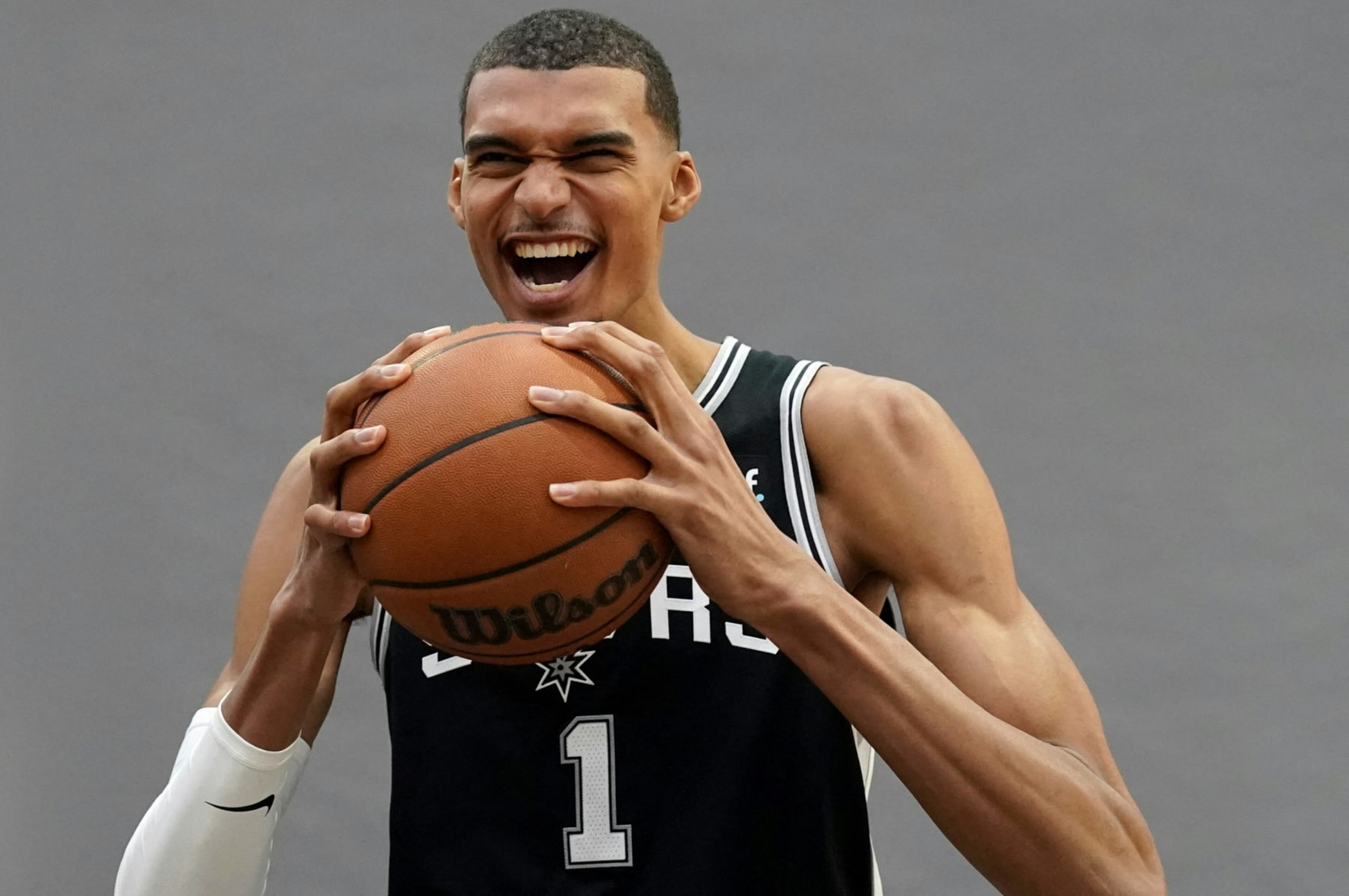 San Antonio Spurs French center #01 Victor Wembanyama poses for photos during the San Antonio Spurs media day at the Victory Capital Performance Center in San Antonio, Texas, on October 2, 2023. (Photo by TIMOTHY A. CLARY / AFP) (Photo by TIMOTHY A. CLARY/AFP via Getty Images)