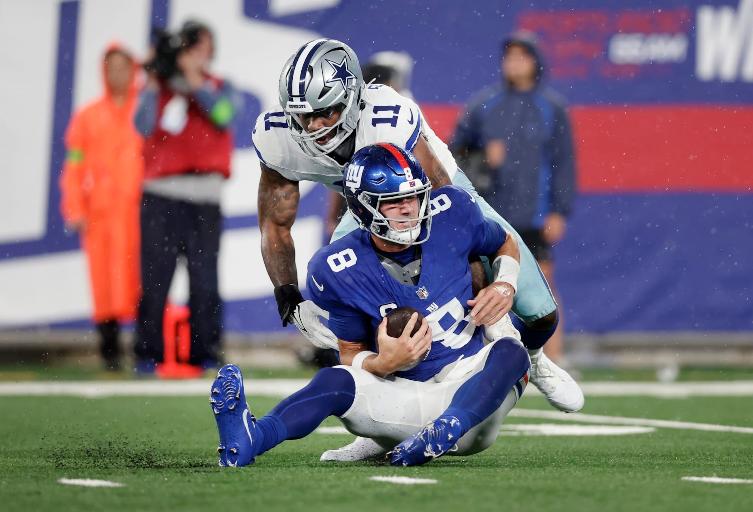 EAST RUTHERFORD, NEW JERSEY - SEPTEMBER 10: (NEW YORK DAILIES OUT)  Daniel Jones #8 of the New York Giants is sacked in the first half by Micah Parsons #11 of the Dallas Cowboys at MetLife Stadium on September 10, 2023 in East Rutherford, New Jersey. The Cowboys defeated the Giants 40-0. (Photo by Jim McIsaac/Getty Images)