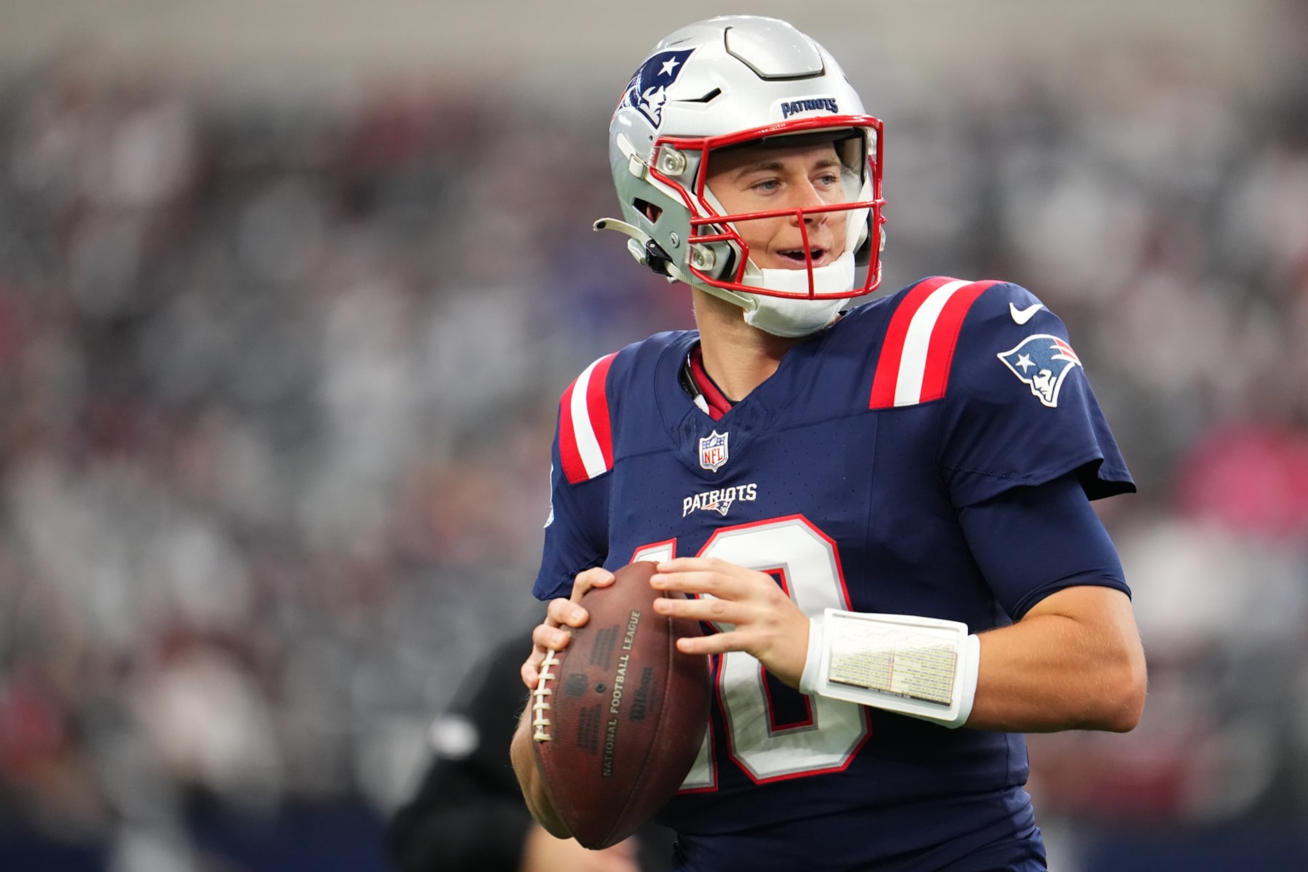 ARLINGTON, TX - OCTOBER 01: Mac Jones #10 of the New England Patriots warms up before kickoff against the Dallas Cowboys at AT&T Stadium on October 1, 2023 in Arlington, Texas. (Photo by Cooper Neill/Getty Images)