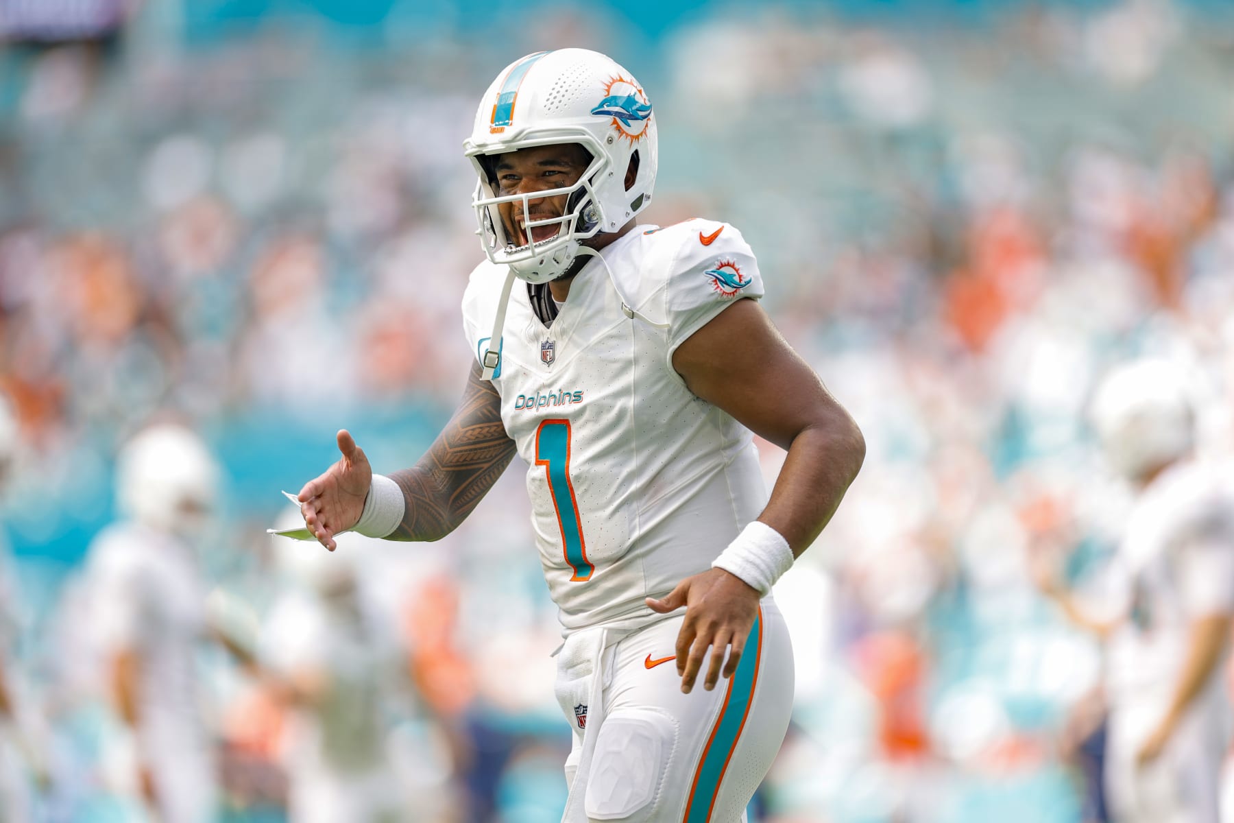 MIAMI GARDENS, FLORIDA - SEPTEMBER 24: Tua Tagovailoa #1 of the Miami Dolphins in action against the Denver Broncos at Hard Rock Stadium on September 24, 2023 in Miami Gardens, Florida. (Photo by Carmen Mandato/Getty Images)