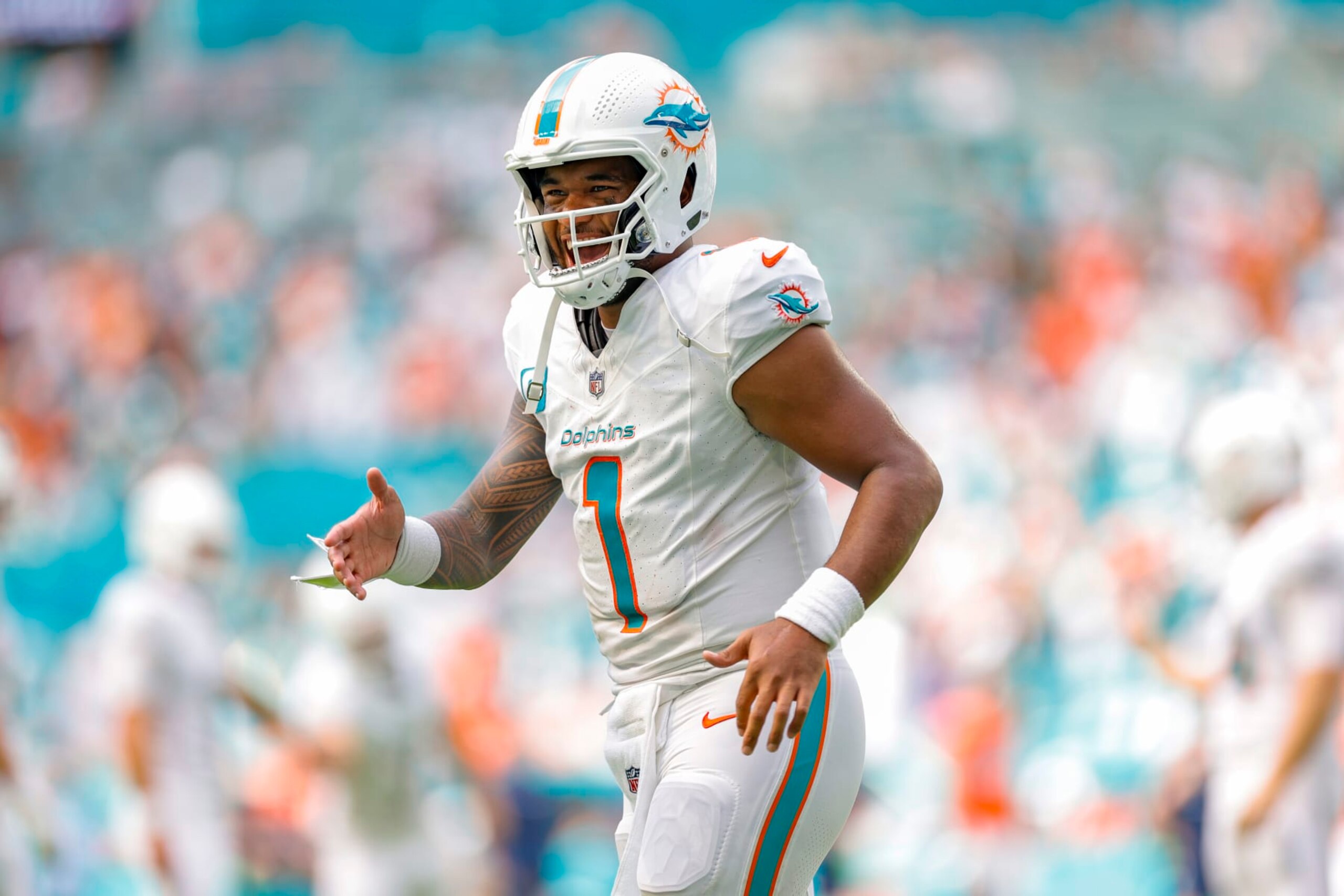 MIAMI GARDENS, FLORIDA - SEPTEMBER 24: Tua Tagovailoa #1 of the Miami Dolphins in action against the Denver Broncos at Hard Rock Stadium on September 24, 2023 in Miami Gardens, Florida. (Photo by Carmen Mandato/Getty Images)