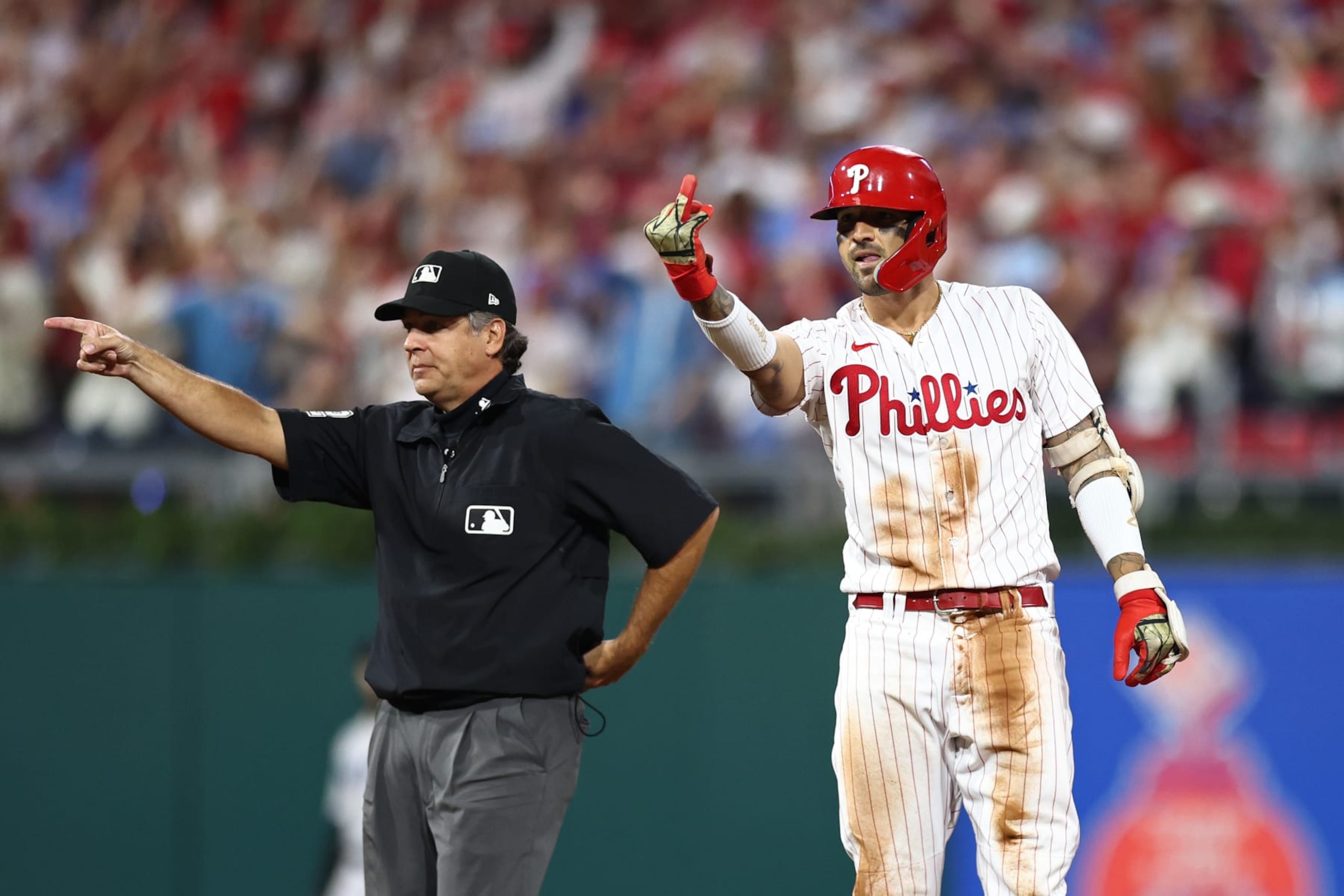 PHILADELPHIA, PENNSYLVANIA - OCTOBER 03: Nick Castellanos #8 of the Philadelphia Phillies gestures after hitting a double during the fourth inning against the Miami Marlins in Game One of the Wild Card Series at Citizens Bank Park on October 03, 2023 in Philadelphia, Pennsylvania. (Photo by Tim Nwachukwu/Getty Images)