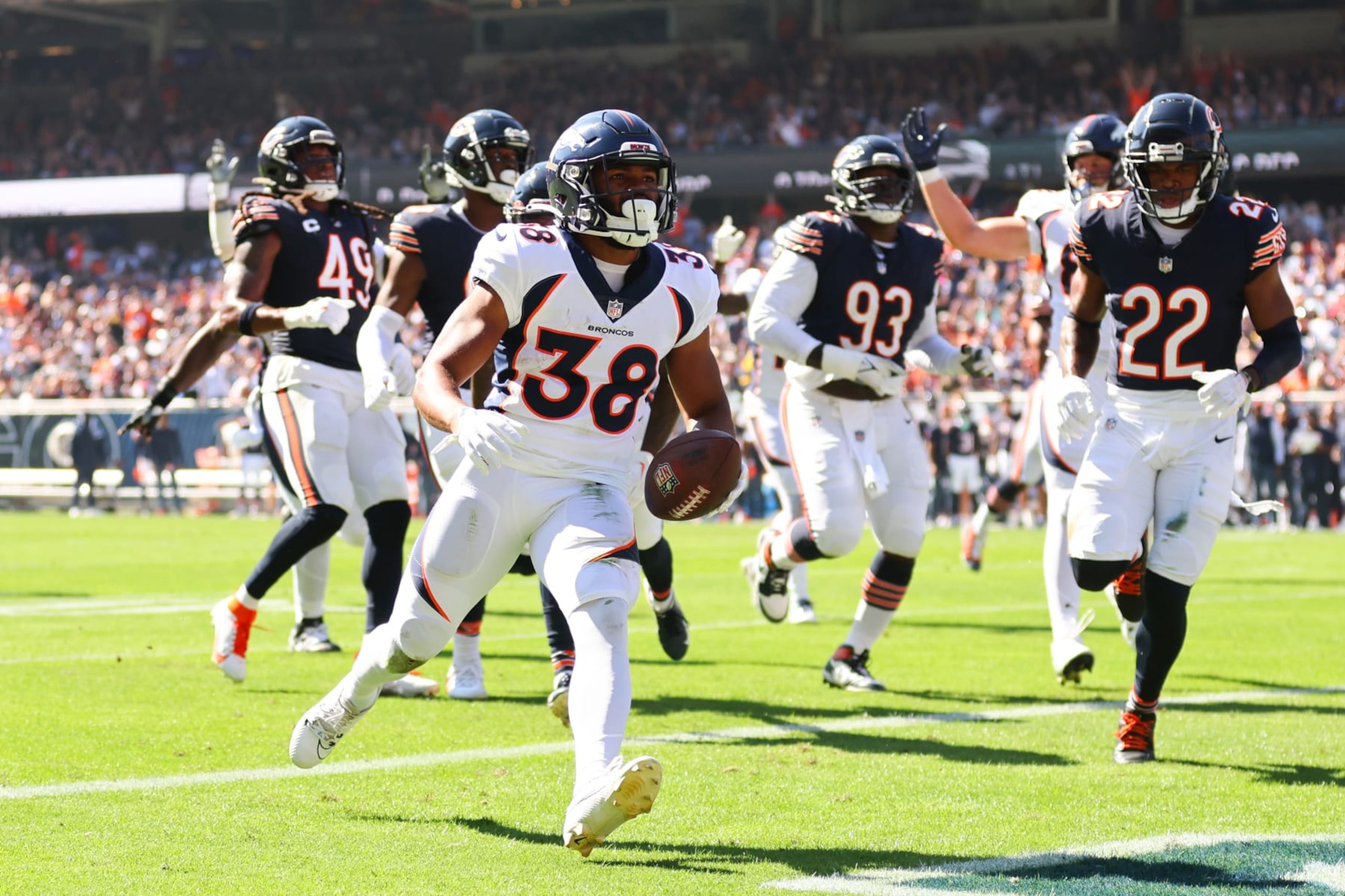CHICAGO, ILLINOIS - OCTOBER 01: Jaleel McLaughlin #38 of the Denver Broncos scores a touchdown against the Chicago Bears during the first quarter at Soldier Field on October 01, 2023 in Chicago, Illinois. (Photo by Michael Reaves/Getty Images)