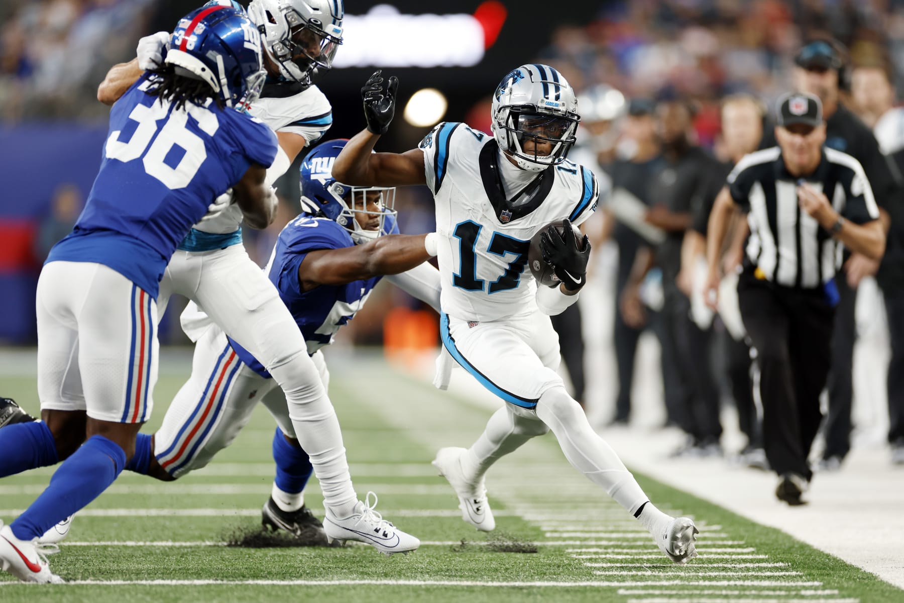 EAST RUTHERFORD, NEW JERSEY - AUGUST 18: DJ Chark Jr. #17 of the Carolina Panthers carries the ball as Bobby Okereke #58 of the New York Giants defends during the first half of a preseason game at MetLife Stadium on August 18, 2023 in East Rutherford, New Jersey. (Photo by Sarah Stier/Getty Images) EAST RUTHERFORD, NEW JERSEY - AUGUST 18: DJ Chark Jr. #17 of the Carolina Panthers carries the ball as Bobby Okereke #58 of the New York Giants defends during the first half of a preseason game at MetLife Stadium on August 18, 2023 in East Rutherford, New Jersey. (Photo by Sarah Stier/Getty Images)