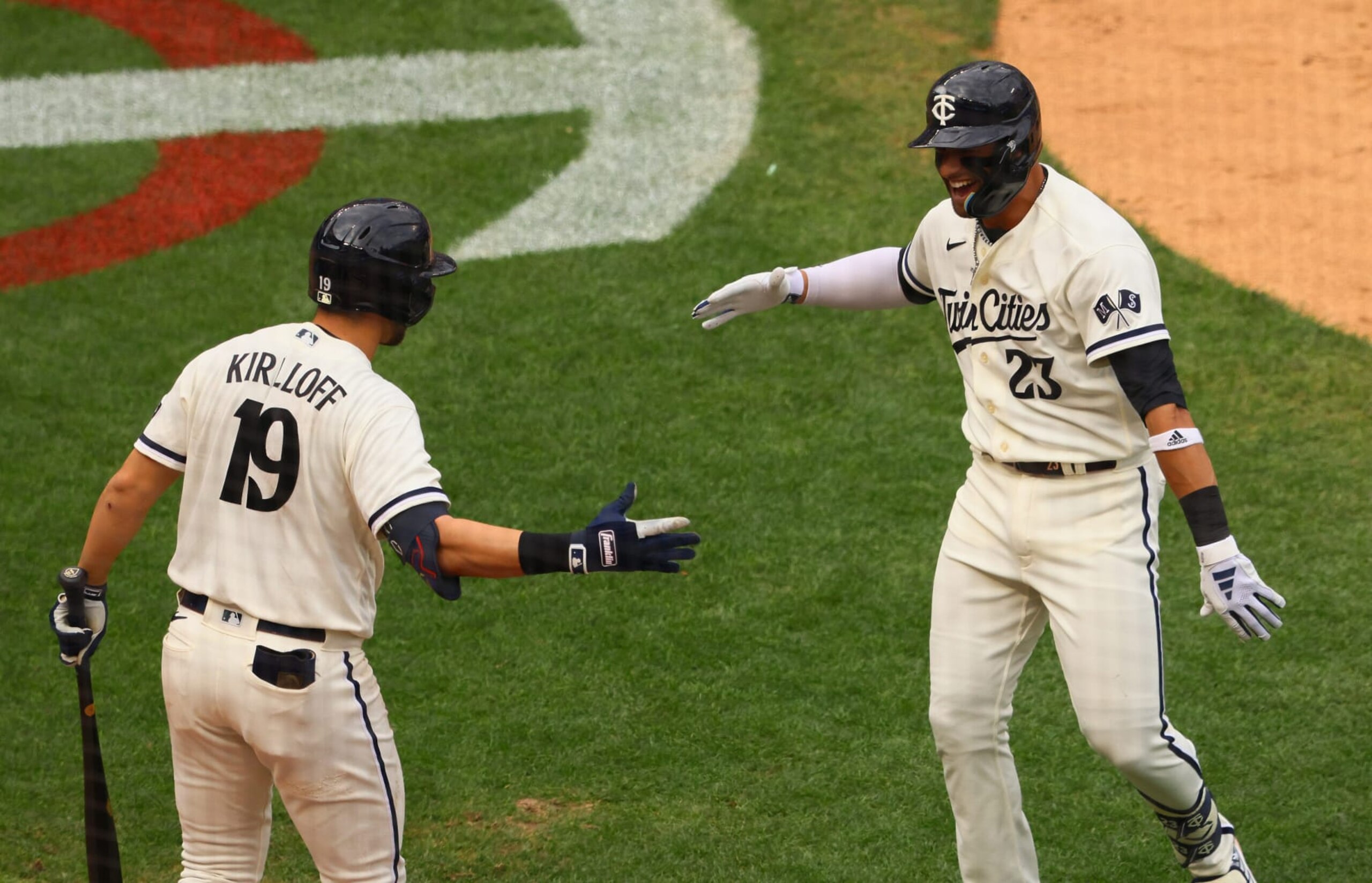 MINNEAPOLIS, MINNESOTA - OCTOBER 3: Royce Lewis #23 Alex Kirilloff #19 of the Minnesota Twins celebrate Lewis' solo home run in the third inning against the Toronto Blue Jays during Game One of the Wild Card Series at Target Field on October 03, 2023 in Minneapolis, Minnesota. (Photo by Adam Bettcher/Getty Images)