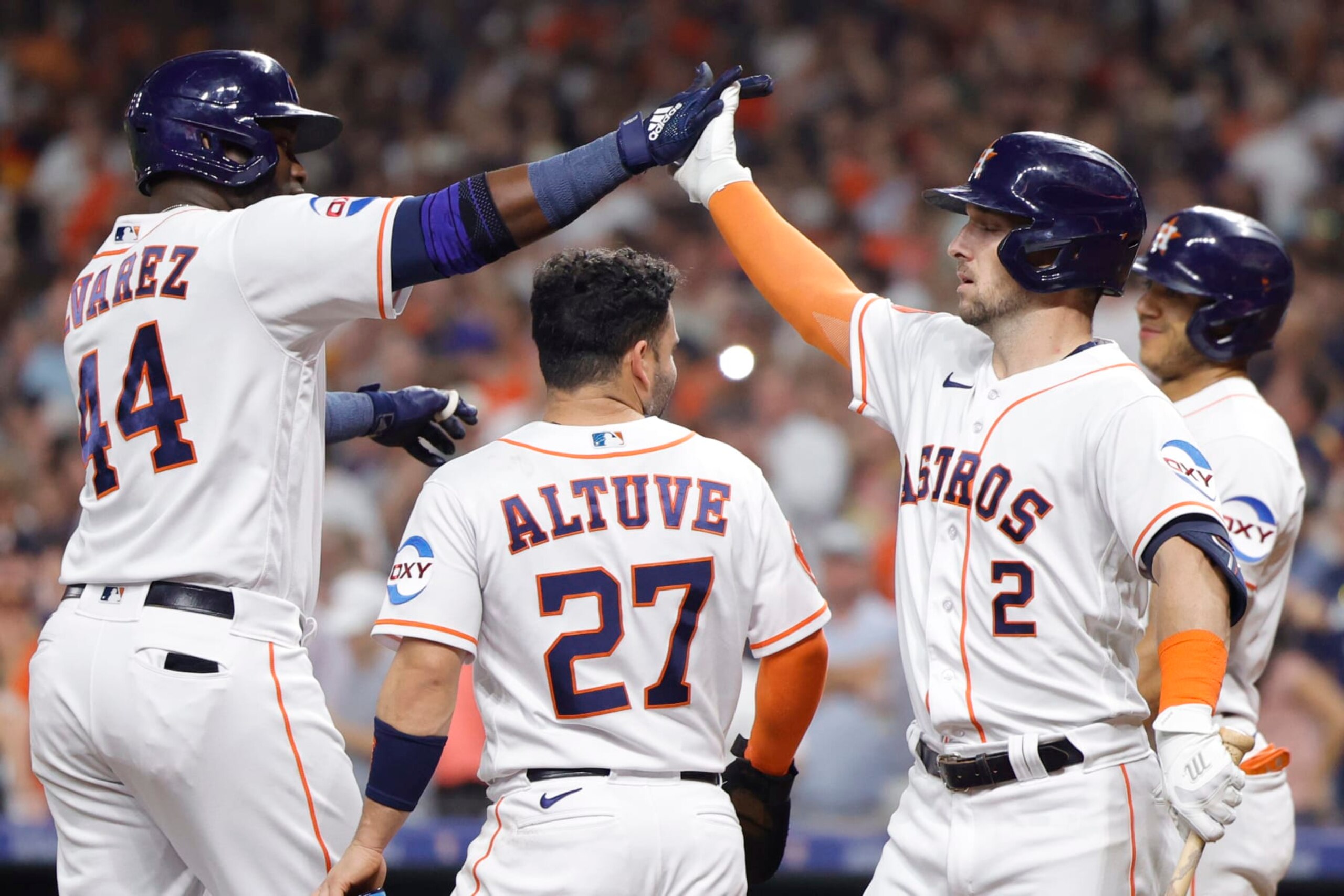Yordan Álvarez (L), Jose Altuve (C) and Alex Bregman (R)