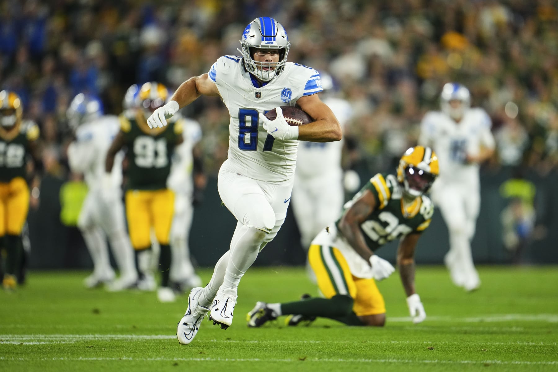 GREEN BAY, WI - SEPTEMBER 28: Sam LaPorta #87 of the Detroit Lions runs the ball during an NFL football game at Lambeau Field on September 28, 2023 in Green Bay, Wisconsin. (Photo by Cooper Neill/Getty Images)