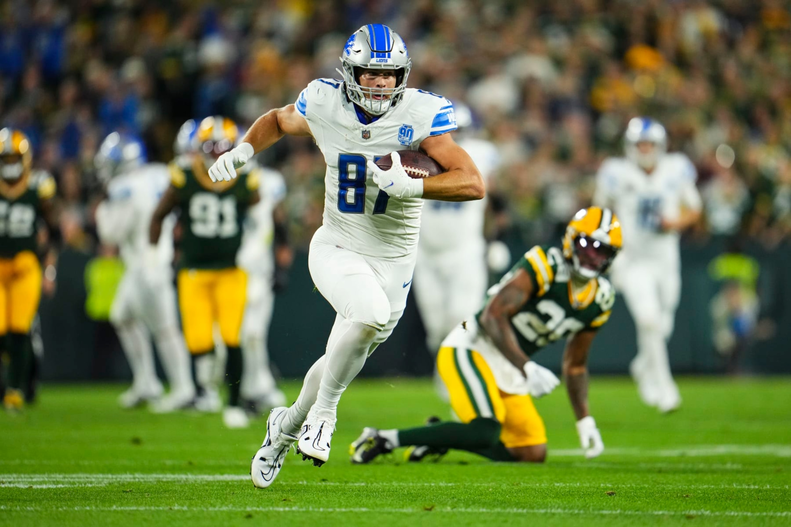 GREEN BAY, WI - SEPTEMBER 28: Sam LaPorta #87 of the Detroit Lions runs the ball during an NFL football game at Lambeau Field on September 28, 2023 in Green Bay, Wisconsin. (Photo by Cooper Neill/Getty Images)