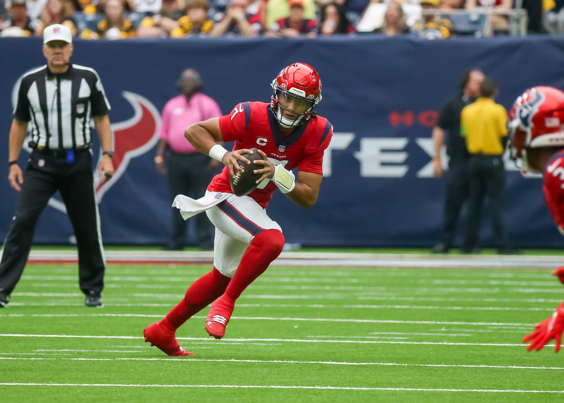 HOUSTON, TX - OCTOBER 01:  Houston Texans quarterback C.J. Stroud (7) looks for an open receiver in the first quarter during the NFL game between the Pittsburgh Steelers and Houston Texans on October 1, 2023 at NRG Stadium in Houston, Texas.  (Photo by Leslie Plaza Johnson/Icon Sportswire via Getty Images)