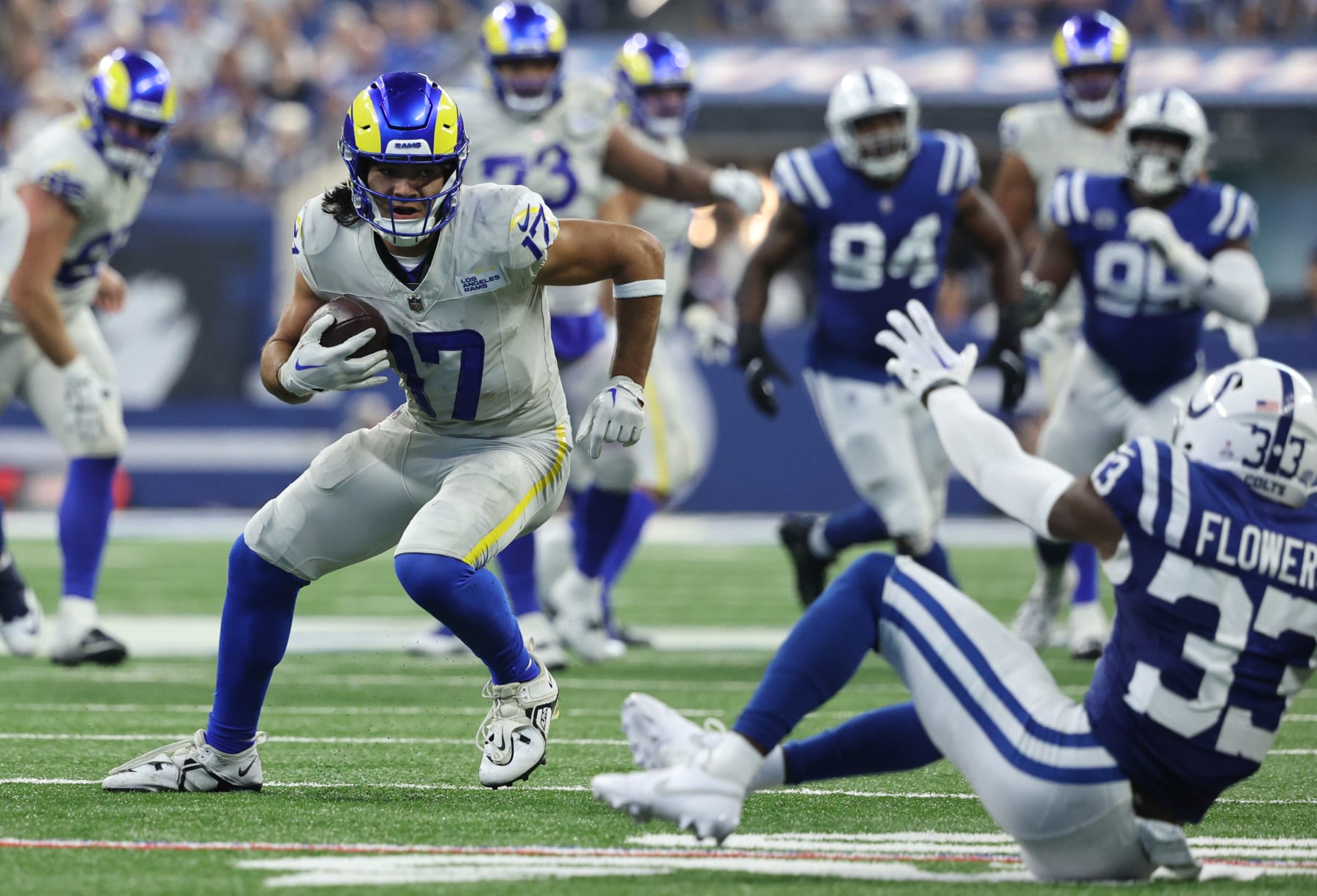 INDIANAPOLIS, INDIANA - OCTOBER 01: Puka Nacua #17 of the Los Angeles Rams runs against Dallis Flowers #33 of the Indianapolis Colts during the second half at Lucas Oil Stadium on October 01, 2023 in Indianapolis, Indiana. (Photo by Michael Hickey/Getty Images)