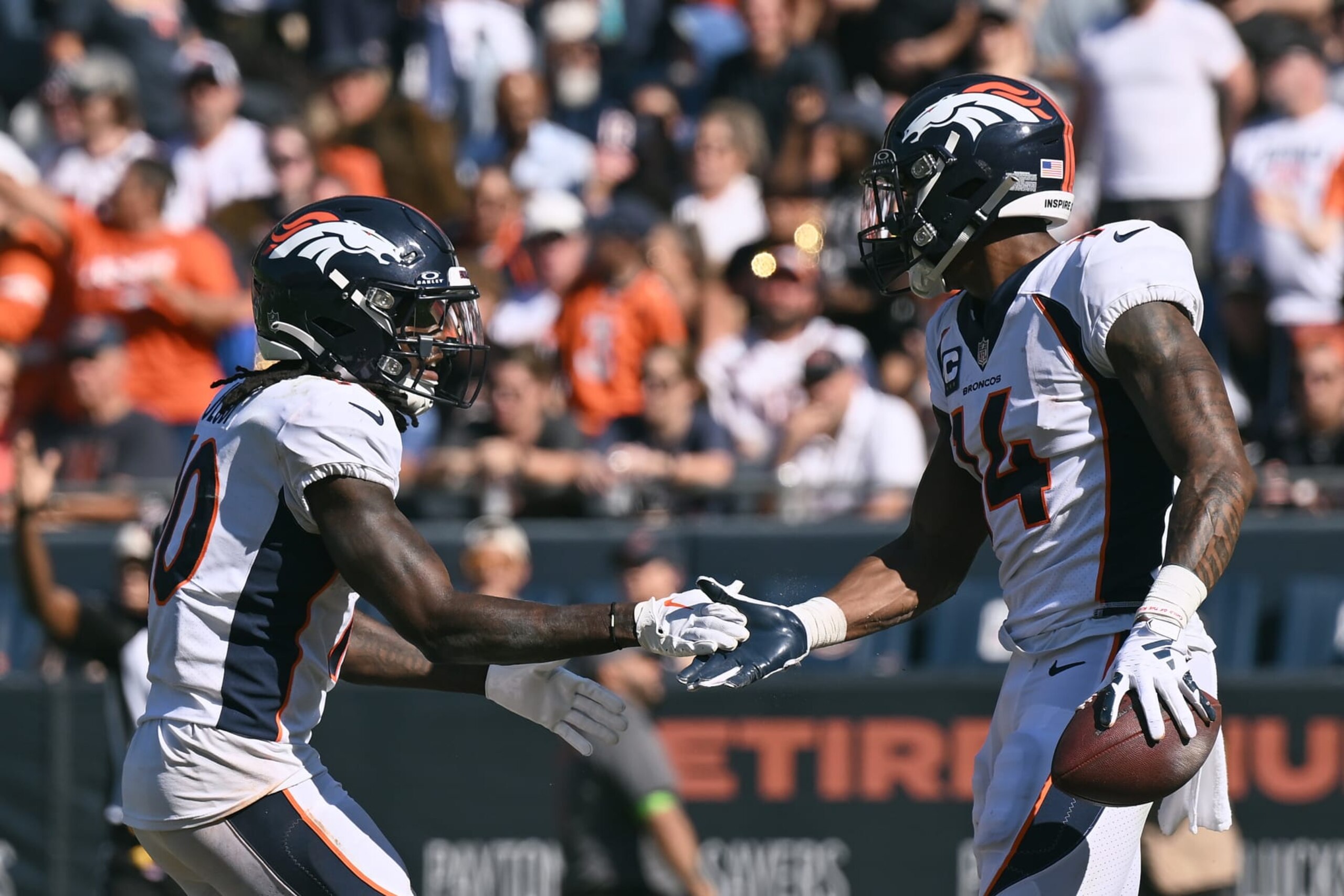CHICAGO, ILLINOIS - OCTOBER 01: Jerry Jeudy #10 and Courtland Sutton #14 of the Denver Broncos celebrate a second half touchdown against the Chicago Bears at Soldier Field on October 01, 2023 in Chicago, Illinois. (Photo by Quinn Harris/Getty Images)