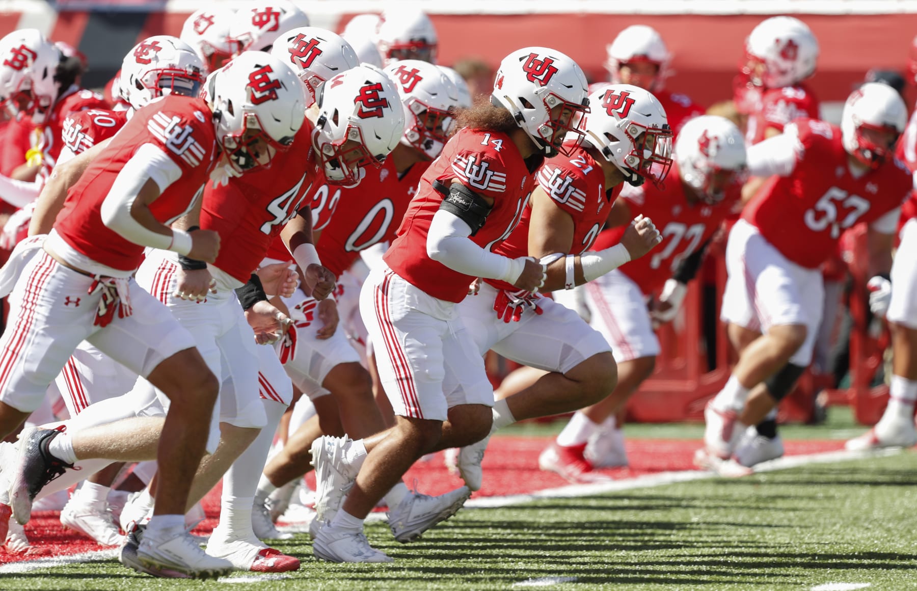 SALT LAKE CITY, UT - SEPTEMBER 23:  Members of the Utah Utes run during warmups before their game against the UCLA Bruins  at Rice-Eccles Stadium September 23, 2023 in Salt Lake City, Utah. (Photo by Chris Gardner/Getty Images)