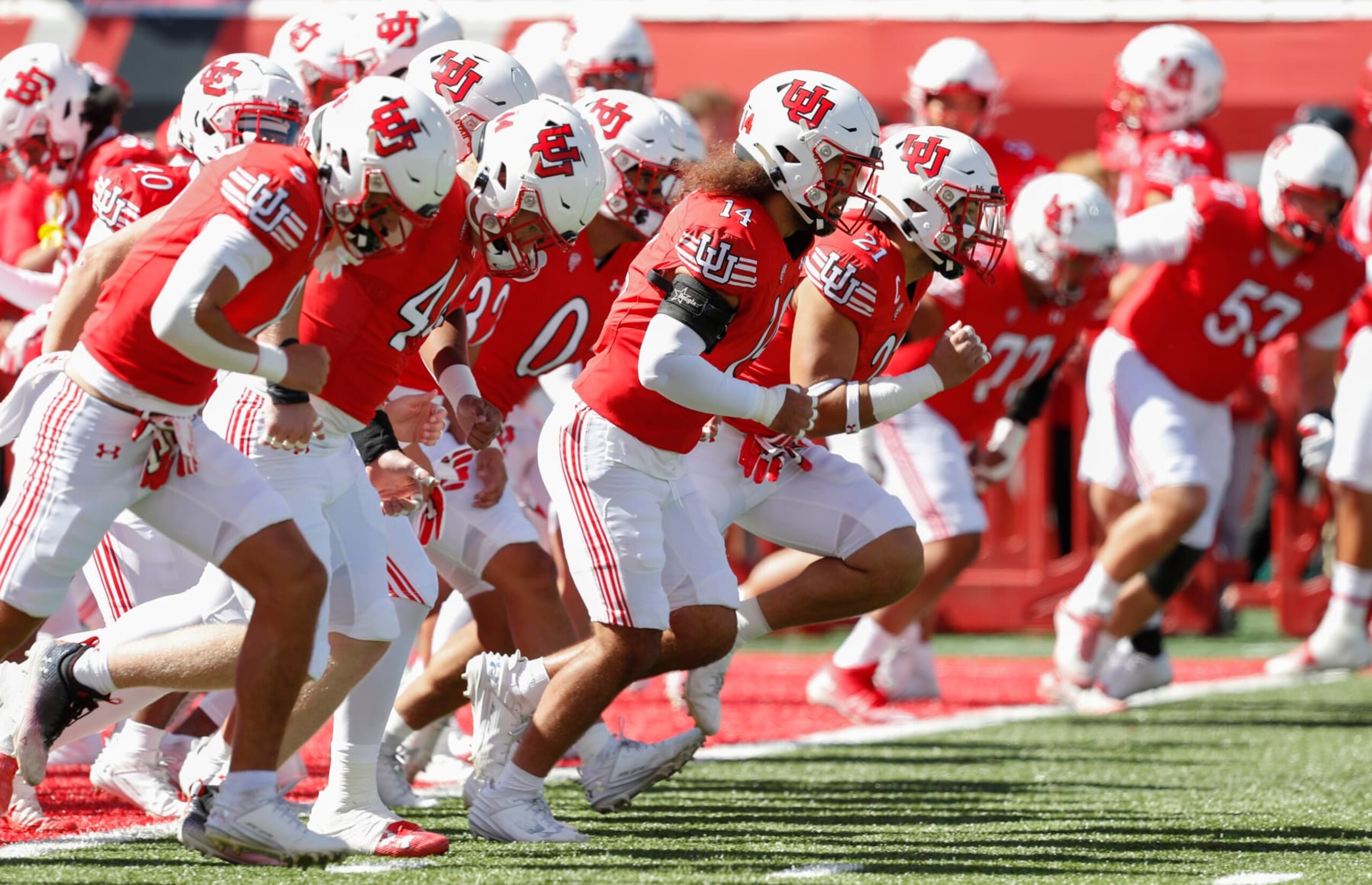 SALT LAKE CITY, UT - SEPTEMBER 23:  Members of the Utah Utes run during warmups before their game against the UCLA Bruins  at Rice-Eccles Stadium September 23, 2023 in Salt Lake City, Utah. (Photo by Chris Gardner/Getty Images)