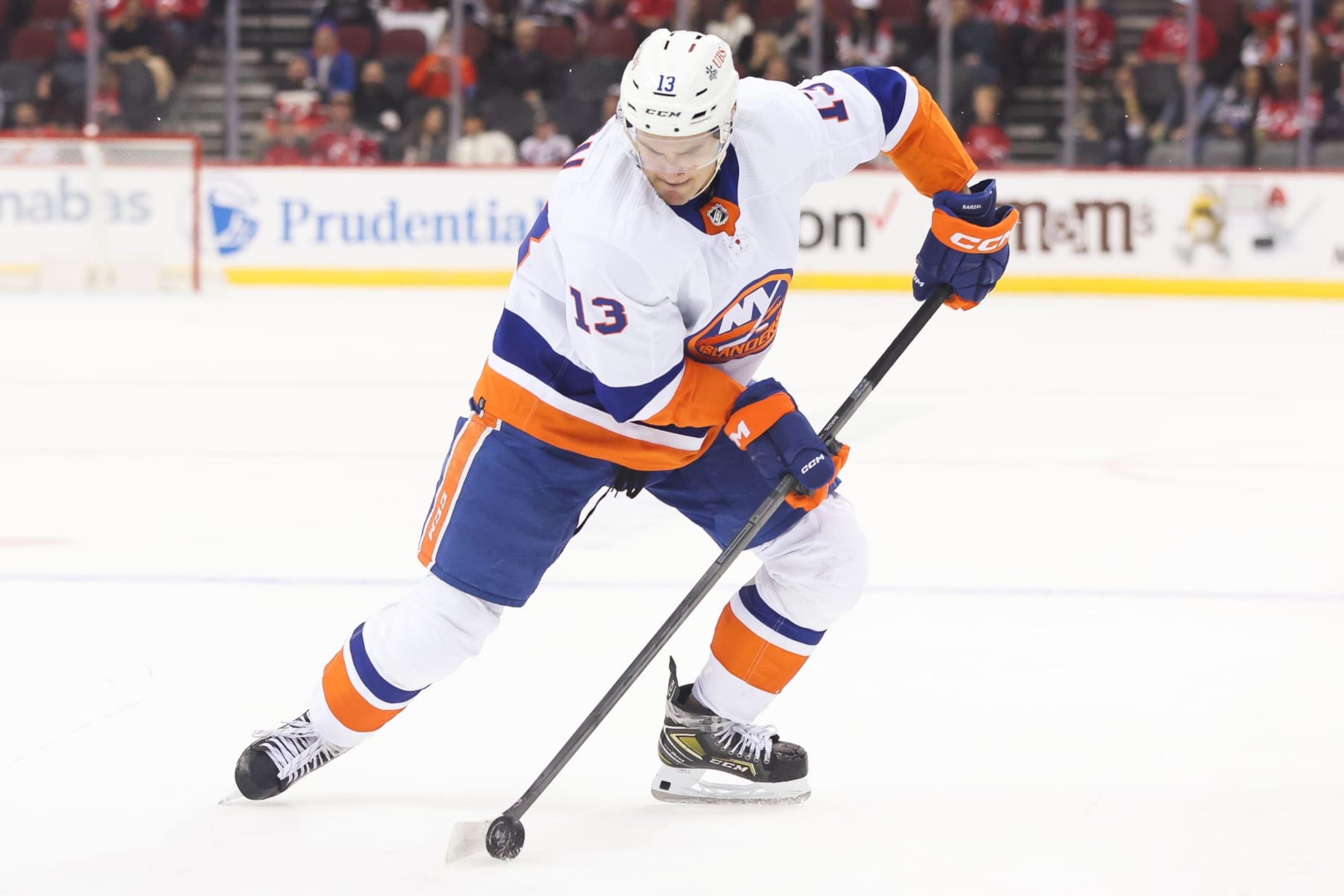 NEWARK, NJ - OCTOBER 02: New York Islanders center Mathew Barzal (13) skates with the puck during a preseason game between the New York Islanders and New Jersey Devils on October 2, 2023 at Prudential Center in the Newark, New Jersey.(Photo by Andrew Mordzynski/Icon Sportswire via Getty Images)