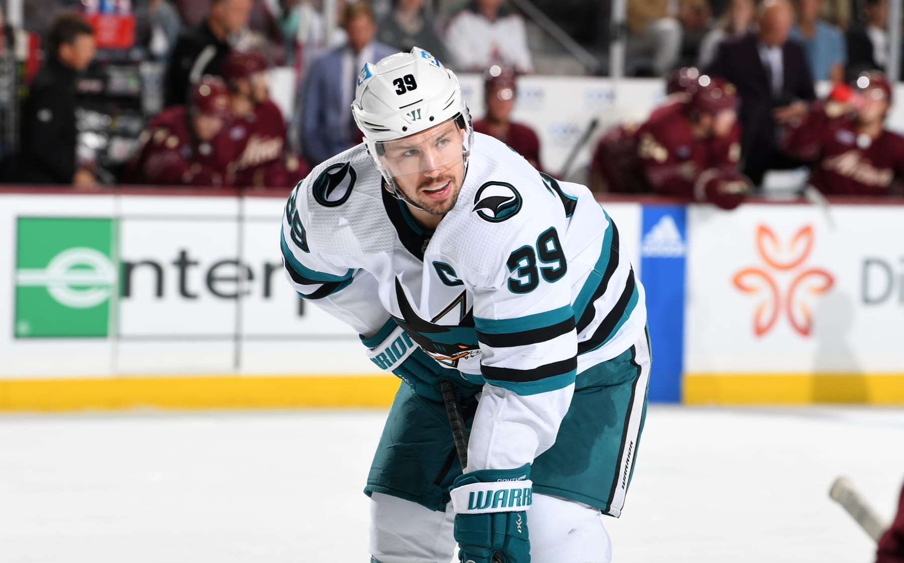 TEMPE, ARIZONA - APRIL 01: Logan Couture #39 of the San Jose Sharks gets ready during a face off against the Arizona Coyotes at Mullett Arena on April 01, 2023 in Tempe, Arizona. (Photo by Norm Hall/NHLI via Getty Images)