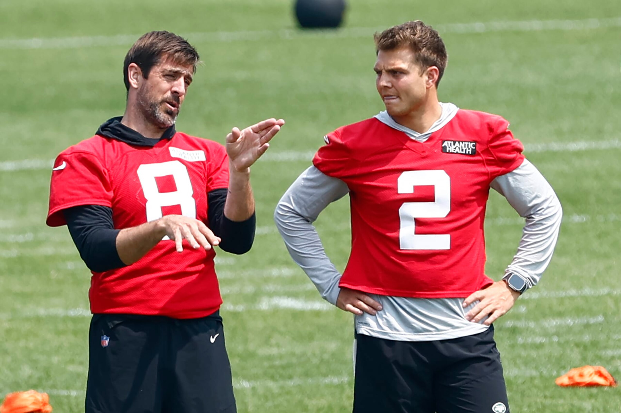 FLORHAM PARK, NEW JERSEY - JUNE 6: Quarterbacks Aaron Rodgers #8 and Zach Wilson #2 of the New York Jets talk during the teams OTAs at Atlantic Health Jets Training Center on June 6, 2023 in Florham Park, New Jersey. (Photo by Rich Schultz/Getty Images)