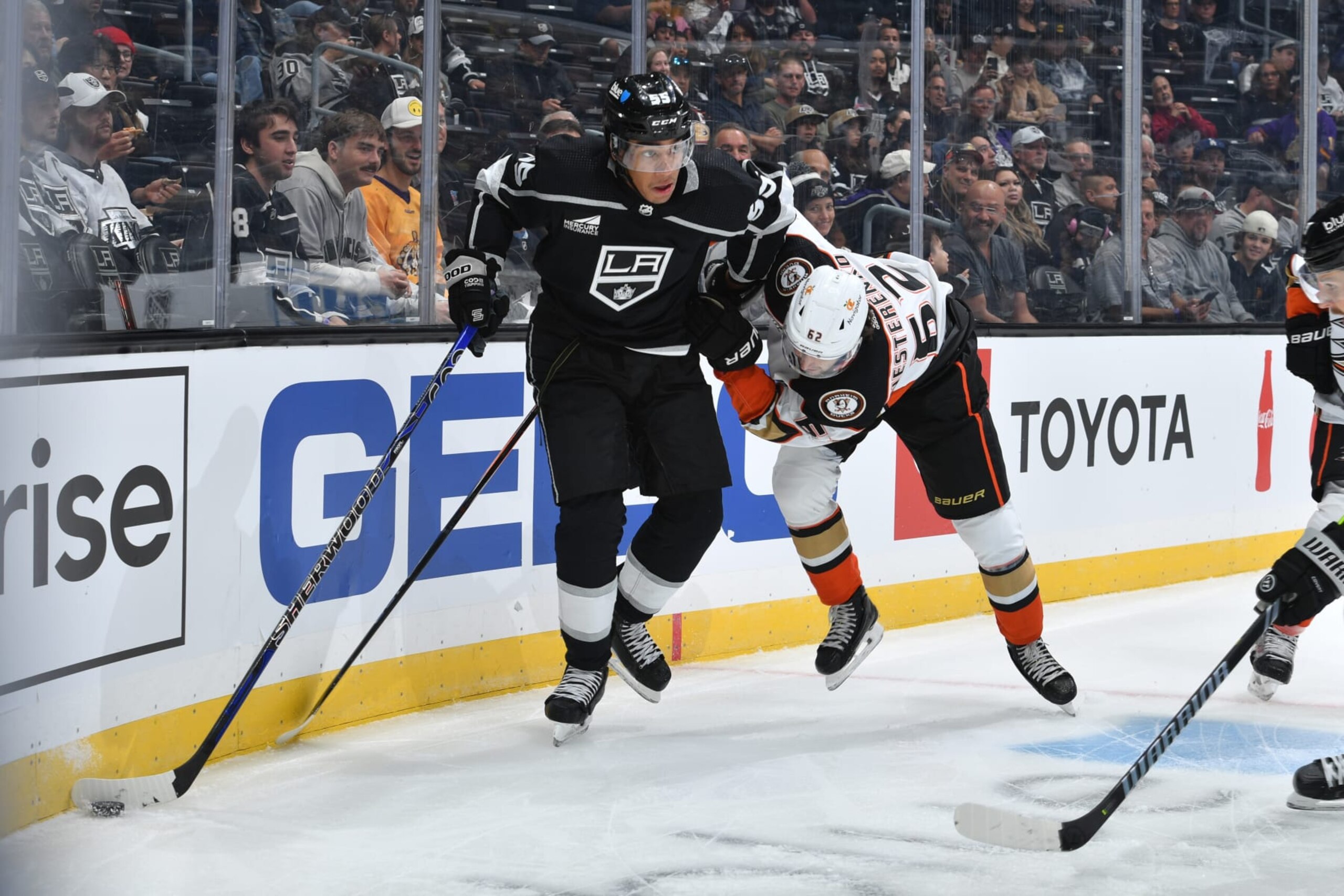 LOS ANGELES, CA - October 3: Quinton Byfield #55 of the Los Angeles Kings and Nikita Nesterenko #62 of the Anaheim Ducksbattle for position during the first period at Crypto.com Arena on October 3, 2023 in Los Angeles, California. (Photo by Juan Ocampo/NHLI via Getty Images)