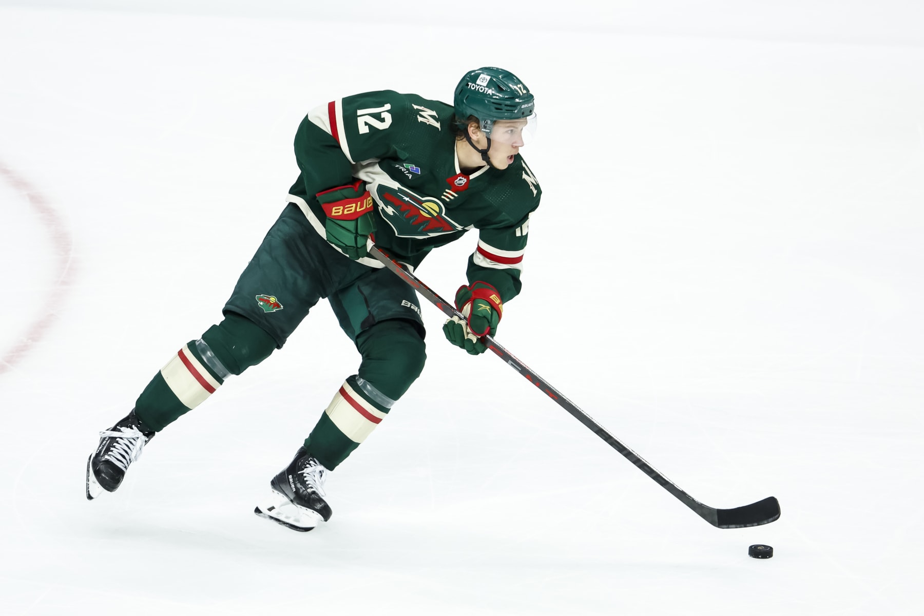 ST PAUL, MN - APRIL 28: Matt Boldy #12 of the Minnesota Wild skates with the puck against the Dallas Stars in the third period in Game Six of the First Round of the 2023 Stanley Cup Playoffs at Xcel Energy Center on April 28, 2023 in St Paul, Minnesota. The Stars defeated the Wild 4-1 to advance to the Second Round. (Photo by David Berding/Getty Images)