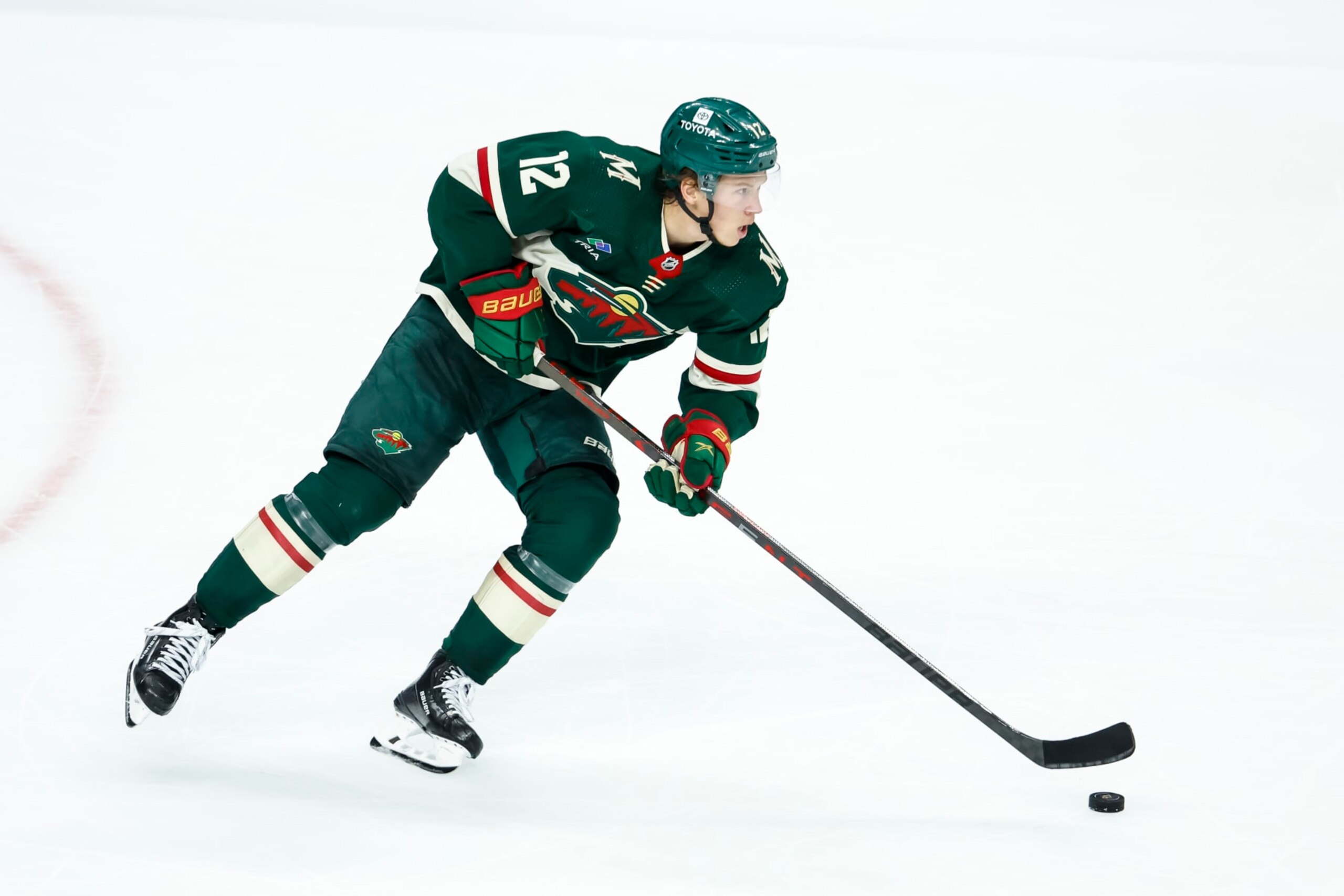 ST PAUL, MN - APRIL 28: Matt Boldy #12 of the Minnesota Wild skates with the puck against the Dallas Stars in the third period in Game Six of the First Round of the 2023 Stanley Cup Playoffs at Xcel Energy Center on April 28, 2023 in St Paul, Minnesota. The Stars defeated the Wild 4-1 to advance to the Second Round. (Photo by David Berding/Getty Images)