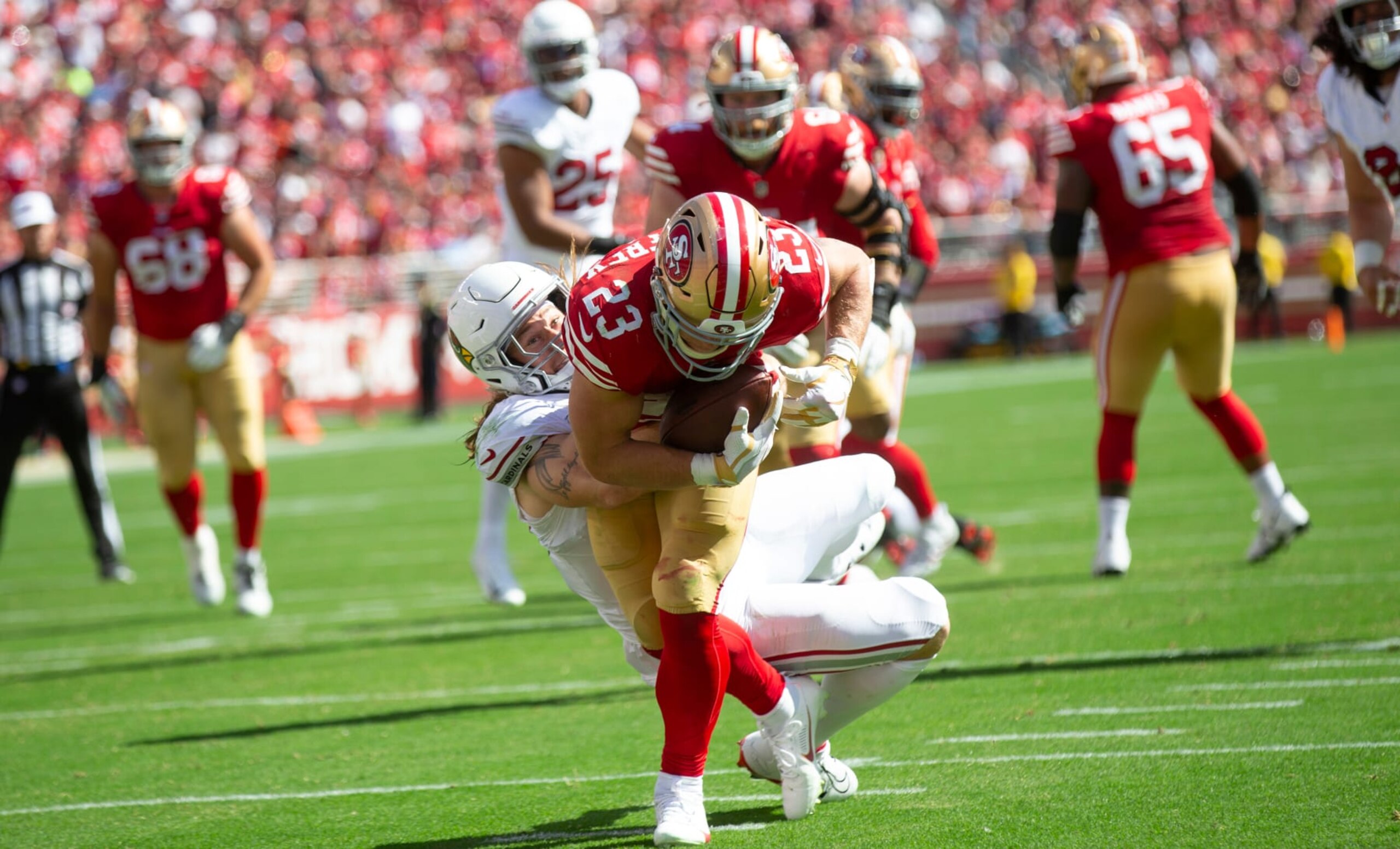 SANTA CLARA, CA - OCTOBER 1: Christian McCaffrey #23 of the San Francisco 49ers makes a 6-yard touchdown catch during the game against the Arizona Cardinals at Levi's Stadium on October 1, 2023 in Santa Clara, California. The 49ers defeated the Cardinals 35-16. (Photo by Michael Zagaris/San Francisco 49ers/Getty Images) SANTA CLARA, CA - OCTOBER 1: Christian McCaffrey #23 of the San Francisco 49ers makes a 6-yard touchdown catch during the game against the Arizona Cardinals at Levi's Stadium on October 1, 2023 in Santa Clara, California. The 49ers defeated the Cardinals 35-16. (Photo by Michael Zagaris/San Francisco 49ers/Getty Images)