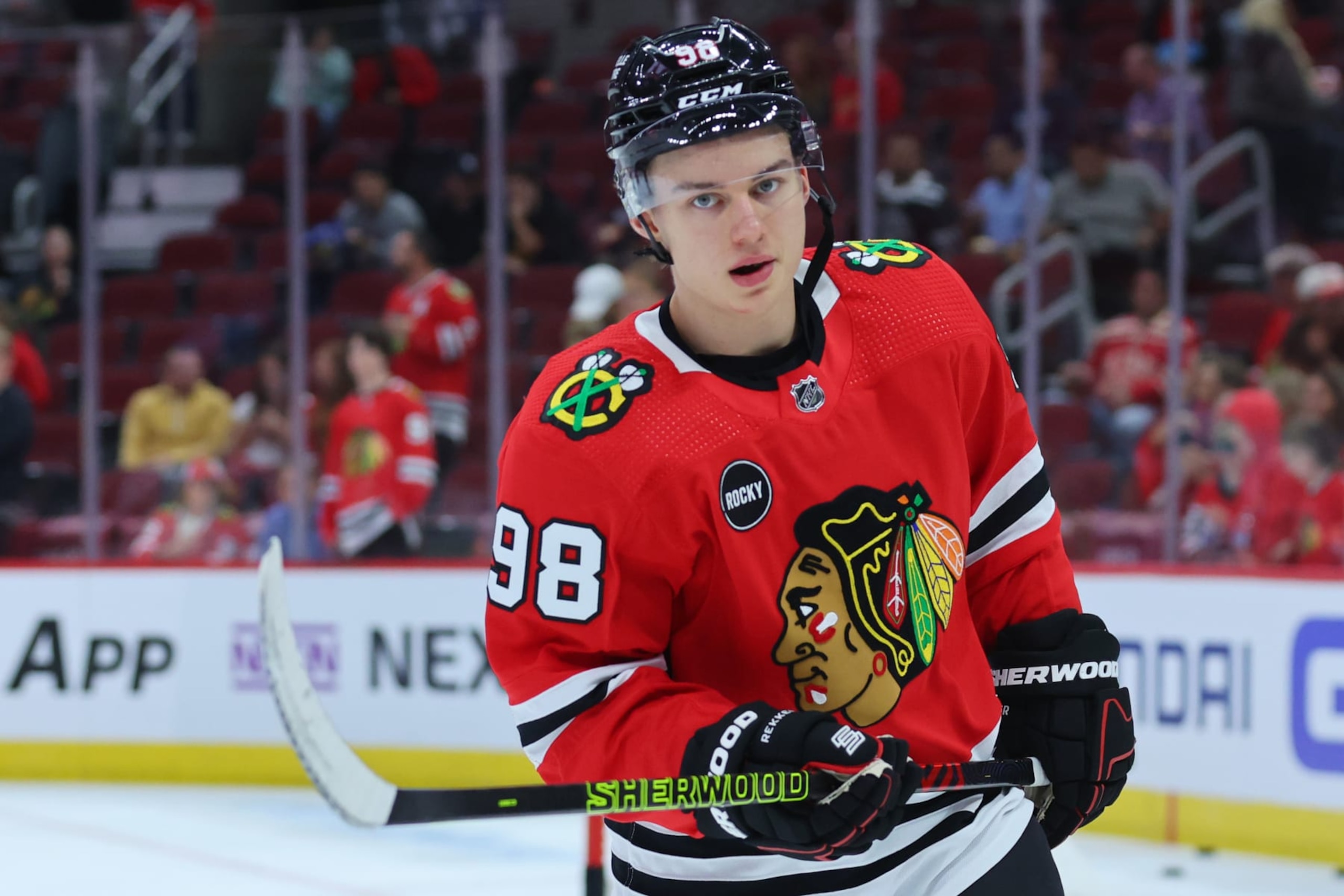 CHICAGO, ILLINOIS - OCTOBER 03: Connor Bedard #98 of the Chicago Blackhawks looks on prior to the preseason game against the Detroit Red Wings at the United Center on October 03, 2023 in Chicago, Illinois. (Photo by Michael Reaves/Getty Images)