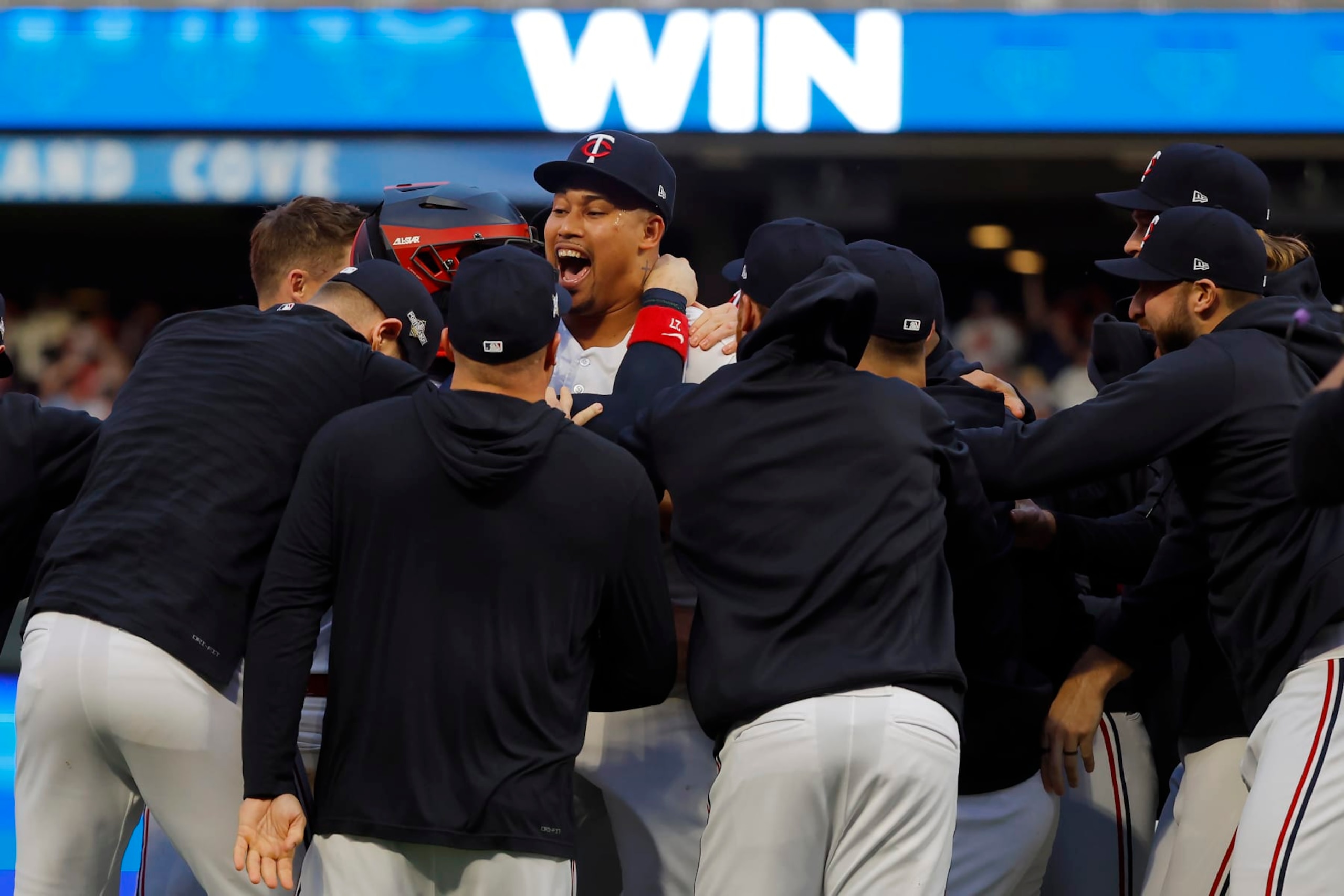Minnesota Twins pitcher Jhoan Duran, middle, celebrates with teammates after the Twins defeated the Toronto Blue Jays in Game 2 of an AL wild-card baseball playoff series Wednesday, Oct. 4, 2023, in Minneapolis. (AP Photo/Bruce Kluckhohn) Minnesota Twins pitcher Jhoan Duran, middle, celebrates with teammates after the Twins defeated the Toronto Blue Jays in Game 2 of an AL wild-card baseball playoff series Wednesday, Oct. 4, 2023, in Minneapolis. (AP Photo/Bruce Kluckhohn)