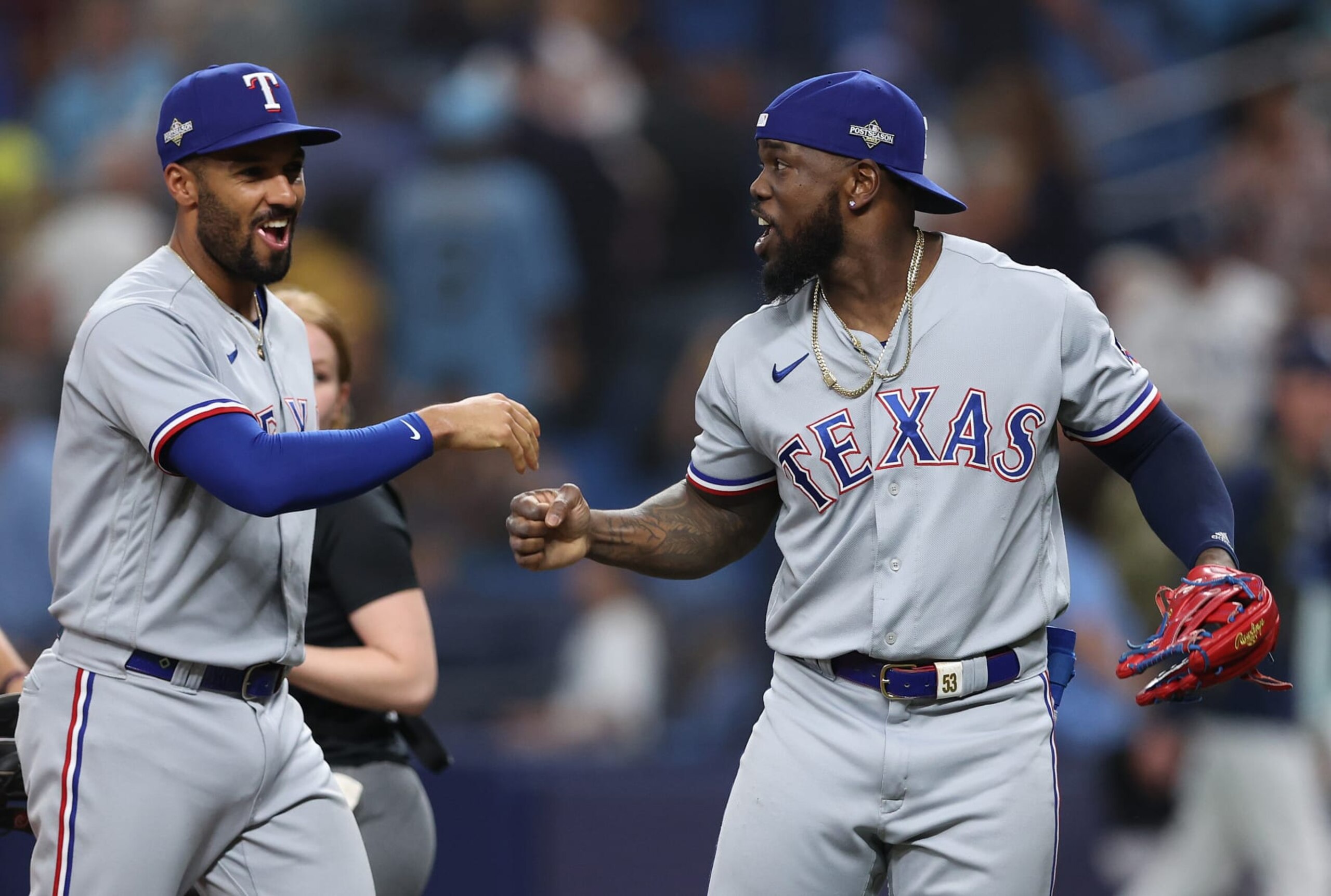ST PETERSBURG, FLORIDA - OCTOBER 04: Adolis Garcia #53 celebrates with Marcus Semien #2 of the Texas Rangers celebrate after defeating the Tampa Bay Rays 7-1in Game Two of the Wild Card Series at Tropicana Field on October 04, 2023 in St Petersburg, Florida. (Photo by Megan Briggs/Getty Images)
