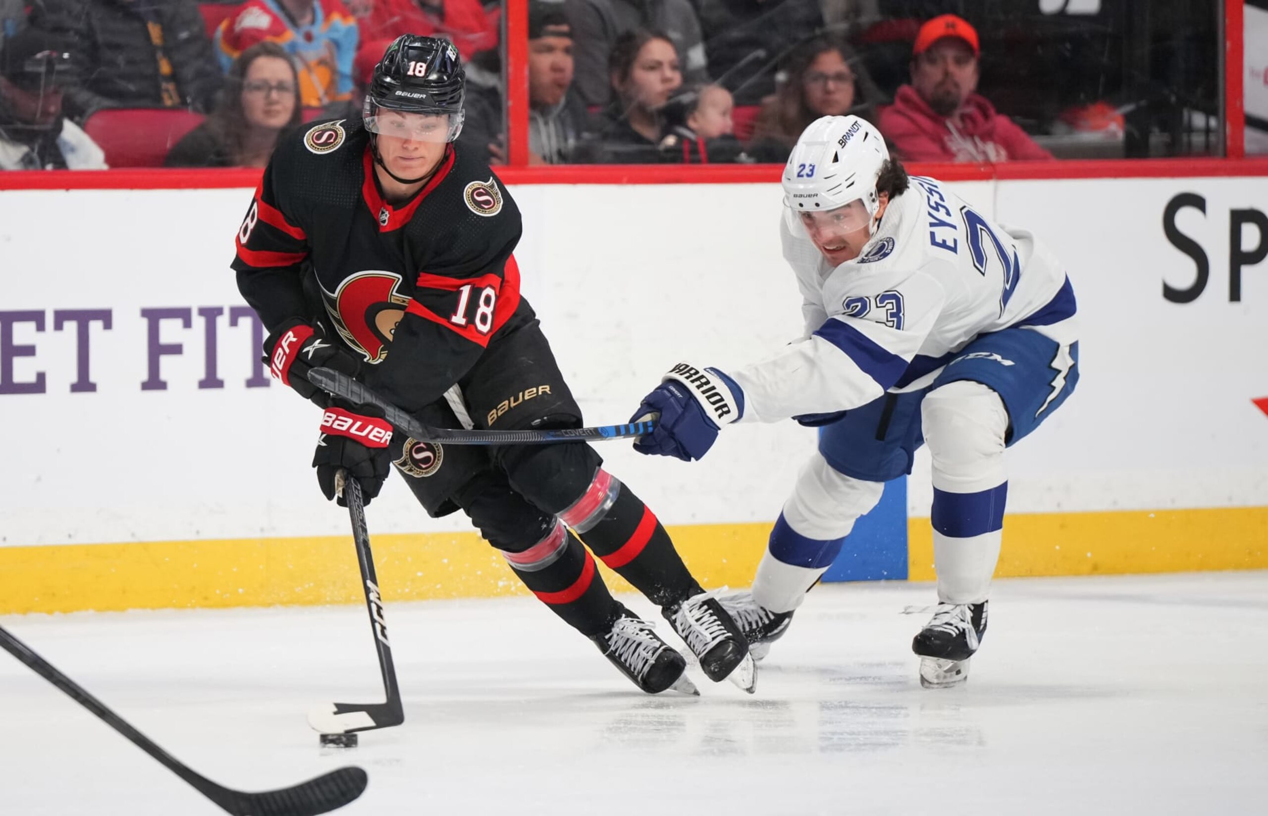 OTTAWA, CANADA - APRIL 8:  Tim Stützle #18 of the Ottawa Senators is slashed by Michael Eyssimont #23 of the Tampa Bay Lightning at Canadian Tire Centre on April 8, 2023 in Ottawa, Ontario, Canada.  (Photo by André Ringuette/NHLI via Getty Images)