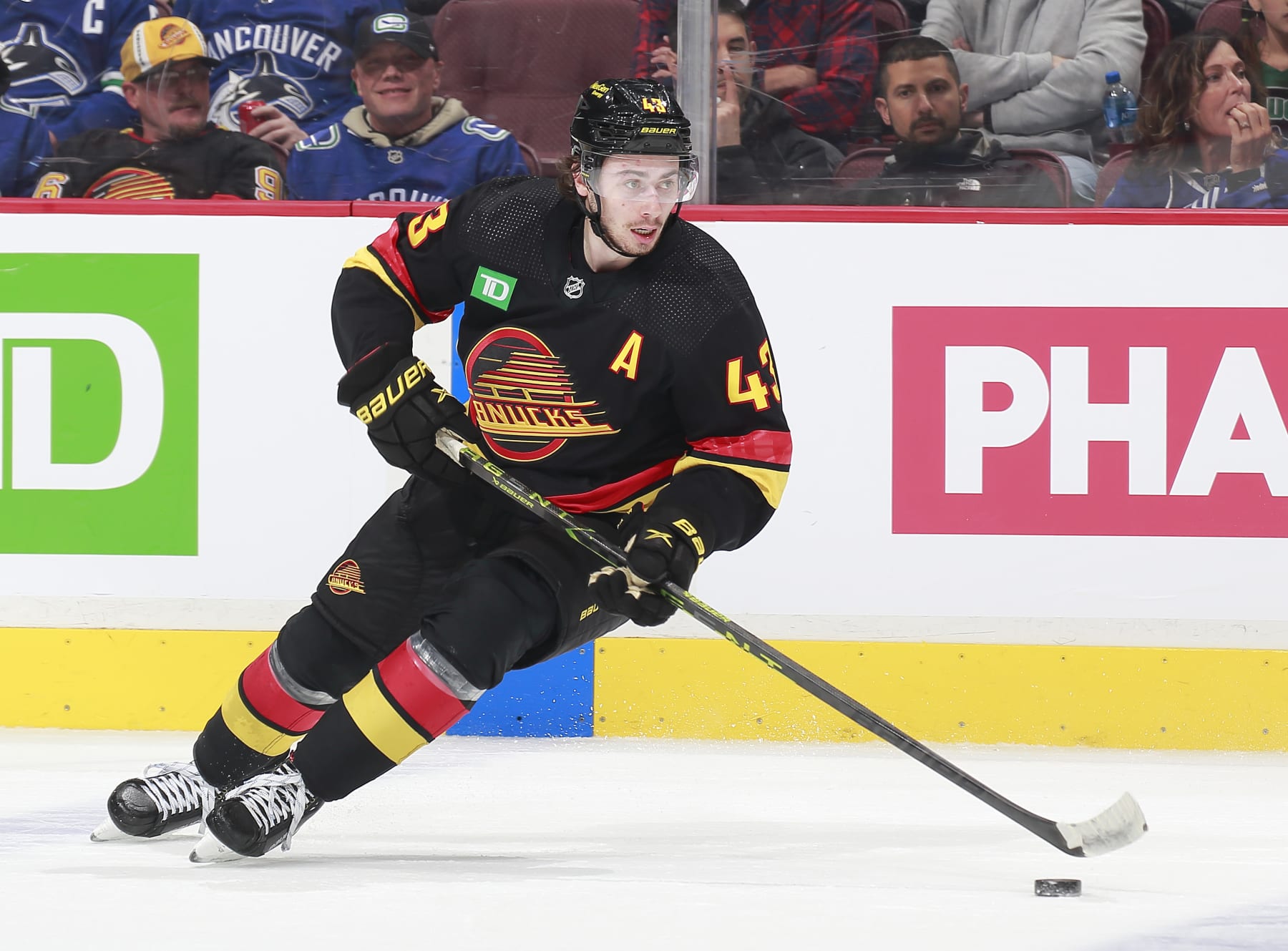 VANCOUVER, CANADA - APRIL 8: Quinn Hughes #43 of the Vancouver Canucks skates up ice during their NHL game against the Calgary Flames at Rogers Arena April 8, 2023 in Vancouver, British Columbia, Canada.  (Photo by Jeff Vinnick/NHLI via Getty Images)