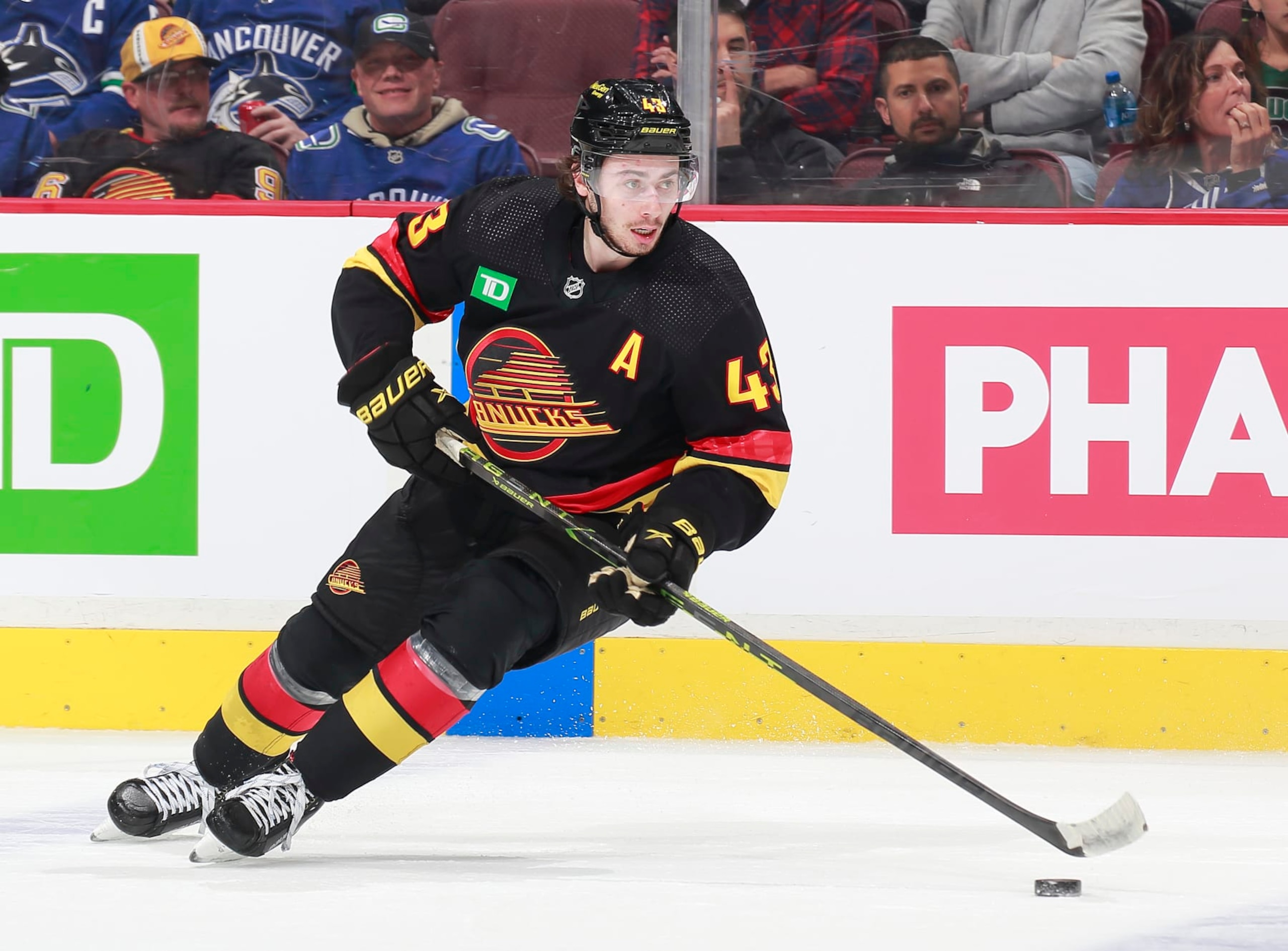 VANCOUVER, CANADA - APRIL 8: Quinn Hughes #43 of the Vancouver Canucks skates up ice during their NHL game against the Calgary Flames at Rogers Arena April 8, 2023 in Vancouver, British Columbia, Canada.  (Photo by Jeff Vinnick/NHLI via Getty Images)