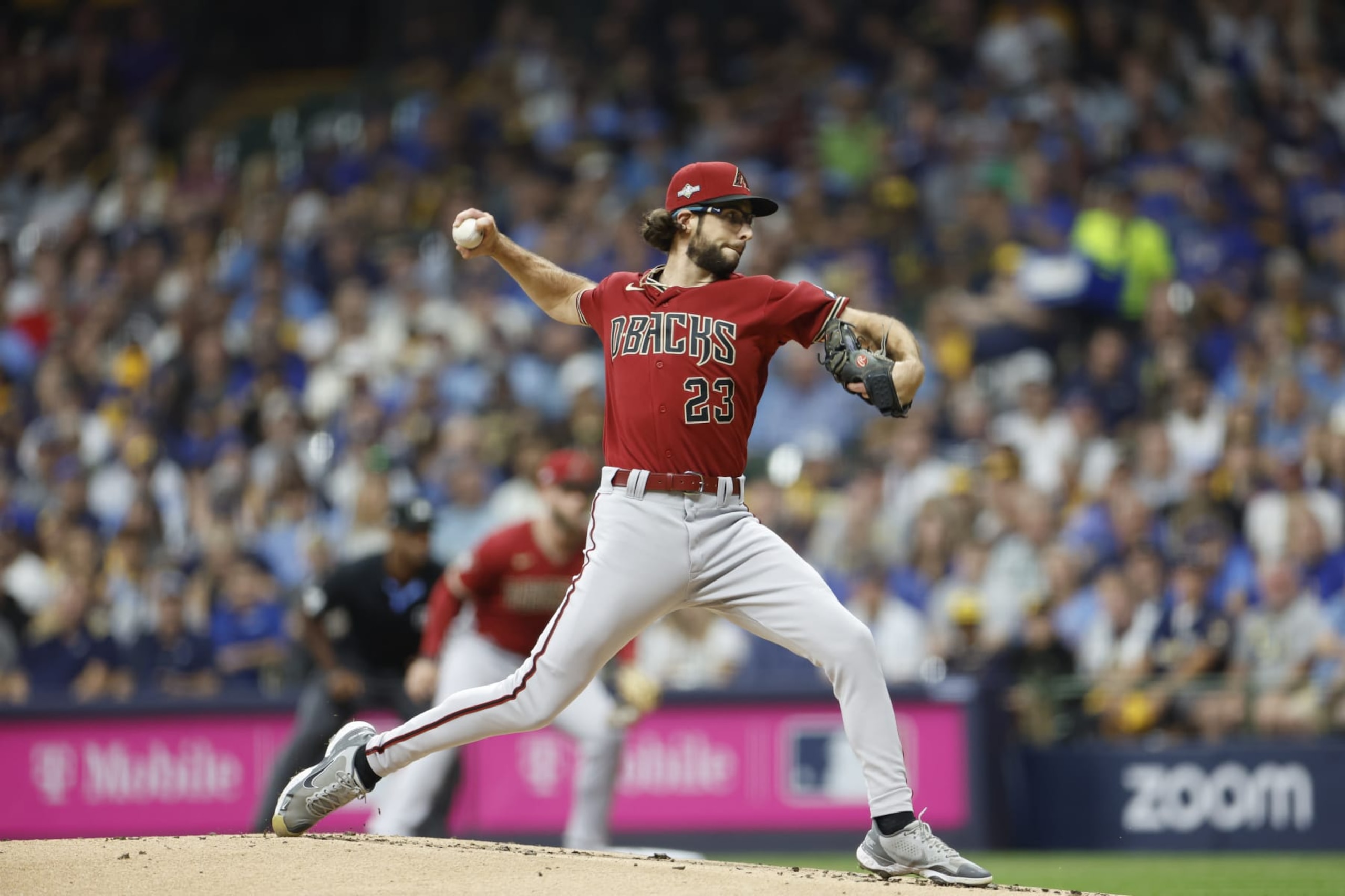 MILWAUKEE, WISCONSIN - OCTOBER 04: Zac Gallen #23 of the Arizona Diamondbacks delivers during the first inning against the Milwaukee Brewers during Game Two of the Wild Card Series at American Family Field on October 04, 2023 in Milwaukee, Wisconsin. (Photo by John Fisher/Getty Images) MILWAUKEE, WISCONSIN - OCTOBER 04: Zac Gallen #23 of the Arizona Diamondbacks delivers during the first inning against the Milwaukee Brewers during Game Two of the Wild Card Series at American Family Field on October 04, 2023 in Milwaukee, Wisconsin. (Photo by John Fisher/Getty Images)