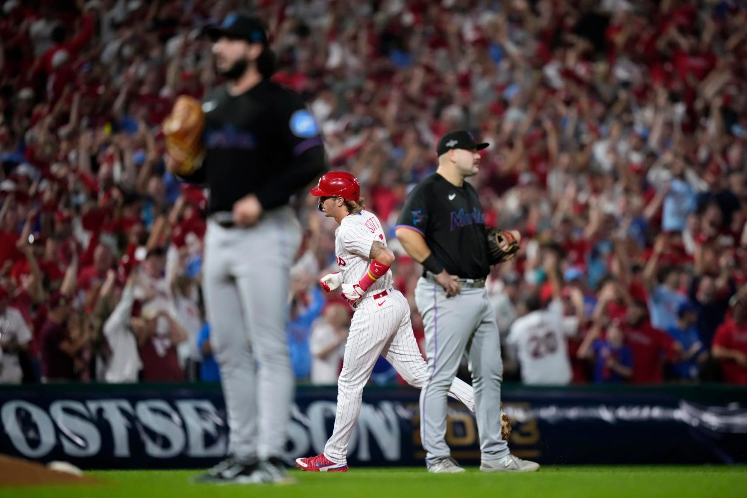 Philadelphia Phillies' Bryson Stott, center, rounds the bases after hitting a grand slam against Miami Marlins pitcher Andrew Nardi during the sixth inning of Game 2 in an NL wild-card baseball playoff series, Wednesday, Oct. 4, 2023, in Philadelphia. (AP Photo/Matt Slocum) Philadelphia Phillies' Bryson Stott, center, rounds the bases after hitting a grand slam against Miami Marlins pitcher Andrew Nardi during the sixth inning of Game 2 in an NL wild-card baseball playoff series, Wednesday, Oct. 4, 2023, in Philadelphia. (AP Photo/Matt Slocum)