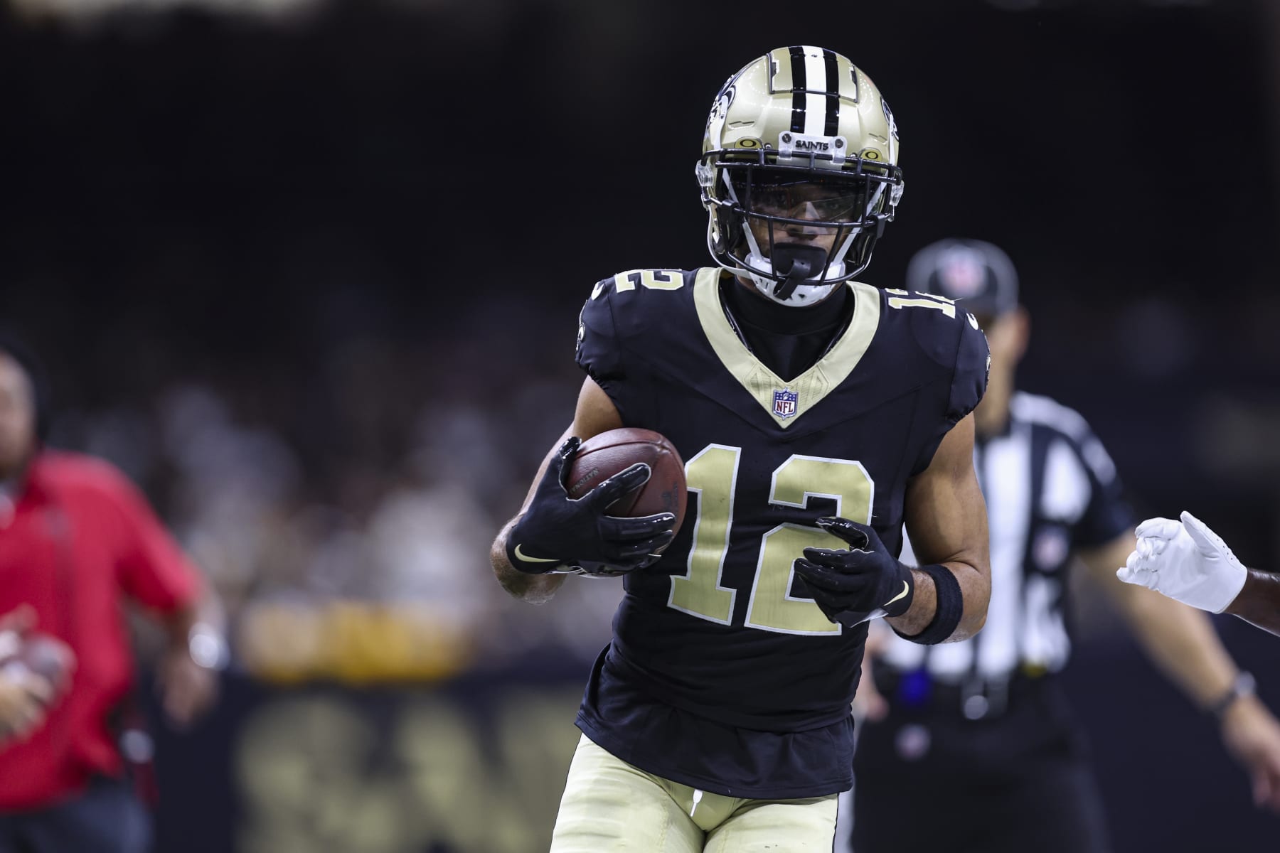 NEW ORLEANS, LA - OCTOBER 01: Chris Olave #12 of the New Orleans Saints runs the ball during an NFL football game against the Tampa Bay Buccaneers at Caesars Superdome on October 1, 2023 in New Orleans, Louisiana. (Photo by Perry Knotts/Getty Images)