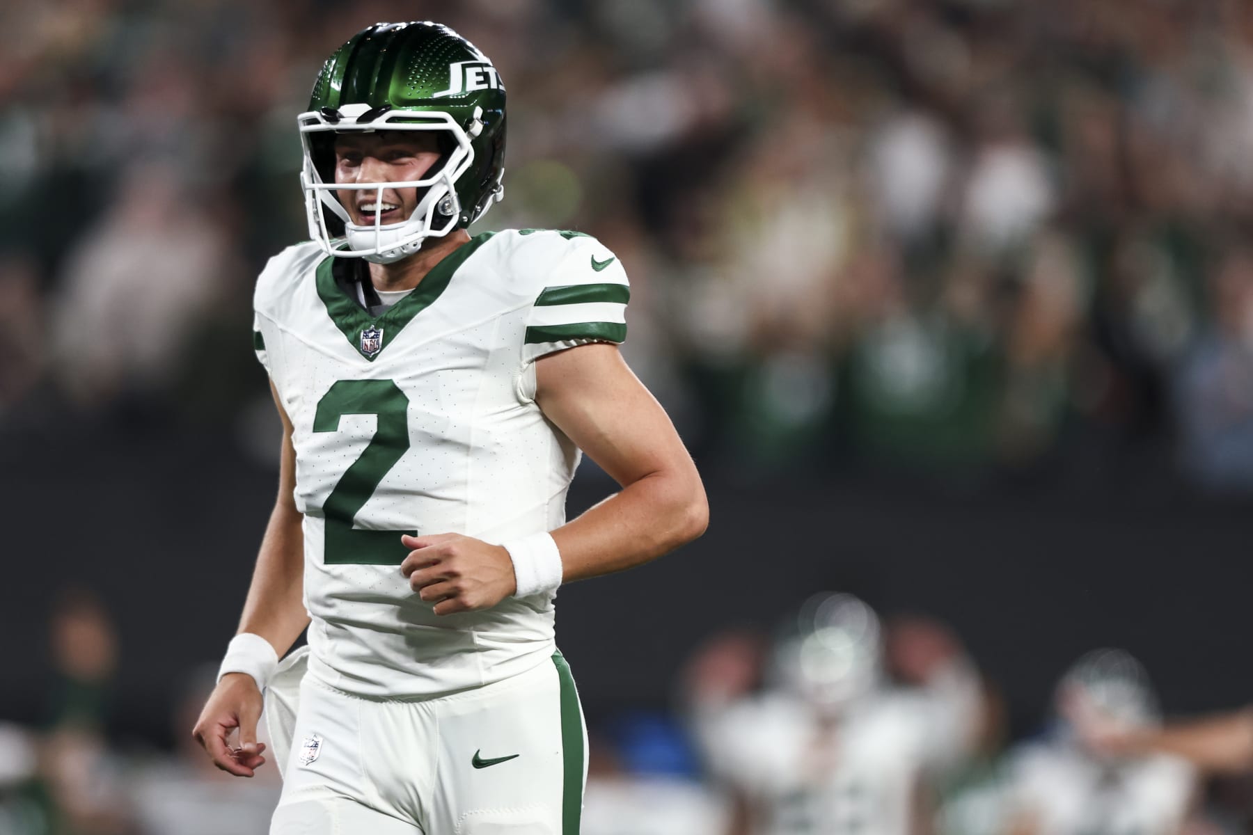 EAST RUTHERFORD, NJ - OCTOBER 1: Zach Wilson #2 of the New York Jets smiles after throwing a touchdown pass during the third quarter of an NFL football game against the Kansas City Chiefs at MetLife Stadium on October 1, 2023 in East Rutherford, New Jersey. (Photo by Kevin Sabitus/Getty Images)